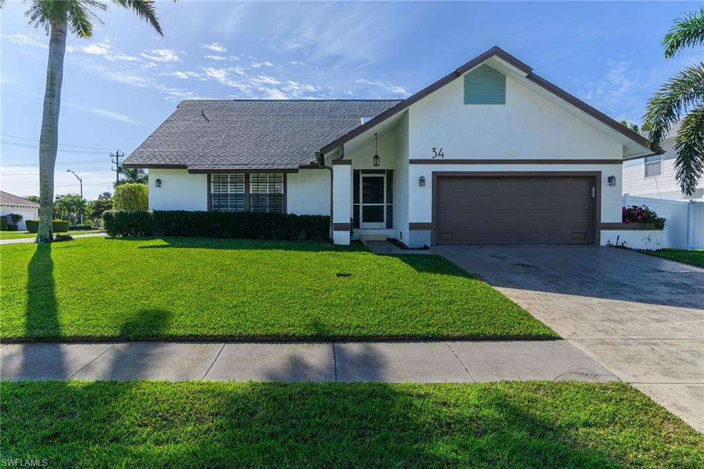 Step into tropical elegance in this beautifully updated Marco Island retreat, where coastal luxury meets effortless comfort. Set on an oversized corner lot, this breathtaking home welcomes you with soaring vaulted ceilings, an open and airy floor plan, and refined beach-cottage décor that perfectly captures the island lifestyle. This 3-bedroom, 2-bath residence has been thoughtfully enhanced with exceptional upgrades throughout. At the heart of the outdoor oasis is a custom concrete pool built in 2022, complemented by a brand-new screen enclosure (2025), a newly installed roof (2025), and a privacy fence (2025) — all adding both beauty and long-term value. Inside, a major remodel elevates every detail. Enjoy brand-new flooring throughout, a stunning chef's kitchen with new cabinetry and custom lighting, new interior doors, elegant base moldings, and sophisticated shiplap accents that lend a polished, luxurious feel. The primary suite and guest bath have been completely redesigned in 2025 with fully permitted renovations, featuring custom tile walk-in showers, new vanities, sinks, and updated plumbing for a spa-like experience. A transferable flood insurance policy is also available for added cost savings. Ideally located near the newly renovated Mackle Park and YMCA, this exceptional property is perfectly suited as a vacation getaway, income-producing rental, or full-time island residence. Just minutes from Marco Island's pristine beaches, premier shopping, dining, and entertainment, this sun-soaked sanctuary offers the very best of coastal living.