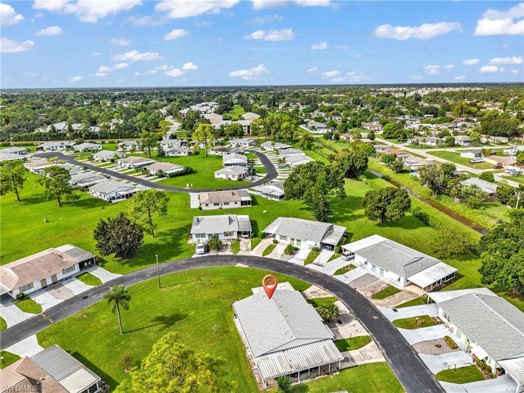 Welcome to easy, low-maintenance Florida living in the desirable 55+ Pinewood Condominium community of Lehigh Acres! This well-maintained 2-bedroom, 2-bathroom home offers a comfortable layout, great updates, and the kind of maintenance-free lifestyle that makes Florida living even better.

Step inside to a bright and welcoming interior featuring IMPACT WINDOWS throughout, providing added storm protection, energy efficiency, and peace of mind year-round. BRAND NEW carpet gives the home a fresh feel, while the NEWER roof and water heater, approximately two years old, add even more value. Both bathrooms feature handicap-height toilets for added comfort and accessibility, and a convenient stackable washer and dryer keeps everything right at your fingertips.

One of the best features of this home is just how easy it is to maintain. The HOA takes care of the entire exterior of the home, allowing you to spend more time enjoying Florida and less time worrying about exterior maintenance and upkeep. A covered carport keeps your vehicle protected from the Florida sun and provides additional storage space.

Pinewood is a welcoming and well-kept 55+ community with low association fees, a relaxed atmosphere, and community amenities that make it easy to enjoy your neighbors and the Florida lifestyle. Spend an afternoon playing SHUFFLEBOARD, gather with friends and neighbors at the community BBQ area, or simply enjoy the laid-back, social atmosphere.

Whether you're looking for a full-time residence, seasonal Florida getaway, or simply a home where you can spend less time worrying about maintenance, this property checks all the boxes. Conveniently located near shopping, dining, medical facilities, and everyday necessities, everything you need is just minutes away.

Pets are allowed, no flood insurance is required, impact windows are already in place, and the exterior maintenance is handled for you. Just move in, get comfortable, and start enjoying the Florida lifestyle!