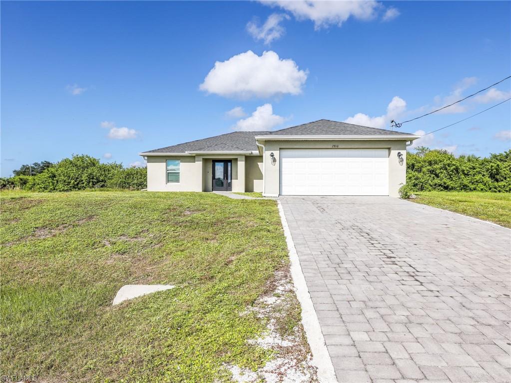 Move in ready 2023 built home in Cape Coral, Florida, featuring 4 bedrooms, 2 bathrooms, 1,565 square feet of living space, a 2 car garage, and a canal view. This newer construction home offers an open concept floor plan, vaulted ceilings in the great room, a modern kitchen with stainless steel appliances, and a backyard with room to add a pool. The paver driveway adds curb appeal, while the canal view creates a scenic backdrop from the main living areas.

The kitchen overlooks the great room, creating an open layout that makes everyday living and entertaining easy. Sliding glass doors provide views of the canal and bring natural light into the living space. Tile flooring throughout the main living areas offers a clean, easy to maintain finish, while carpeted bedrooms provide a comfortable feel. The spacious great room features vaulted ceilings that enhance the open atmosphere and make the living area feel even larger.

The spacious primary bedroom provides room to unwind, while the primary bathroom features dual sinks and a separate shower. The three guest bedrooms are generously sized and share convenient access to the second full bathroom, making this floor plan practical for households that need additional bedrooms and flexible living space.

Built in 2023, this home offers the appeal of newer construction with a move in ready interior, modern finishes, and a functional single story layout. The two car garage provides parking and additional storage, and the paver driveway enhances the home's exterior appearance. The backyard offers room to create your own outdoor living area with the addition of a pool, patio, or outdoor seating space.

Located in Cape Coral, this property offers the opportunity to enjoy Southwest Florida living with a canal view and space to personalize the backyard. With four bedrooms, two bathrooms, an open concept kitchen and great room, vaulted ceilings, stainless steel appliances, a two car garage, and construction completed in 2023, this move in ready Cape Coral home is an excellent option for buyers seeking a newer home with a scenic water view and room to make it their own.