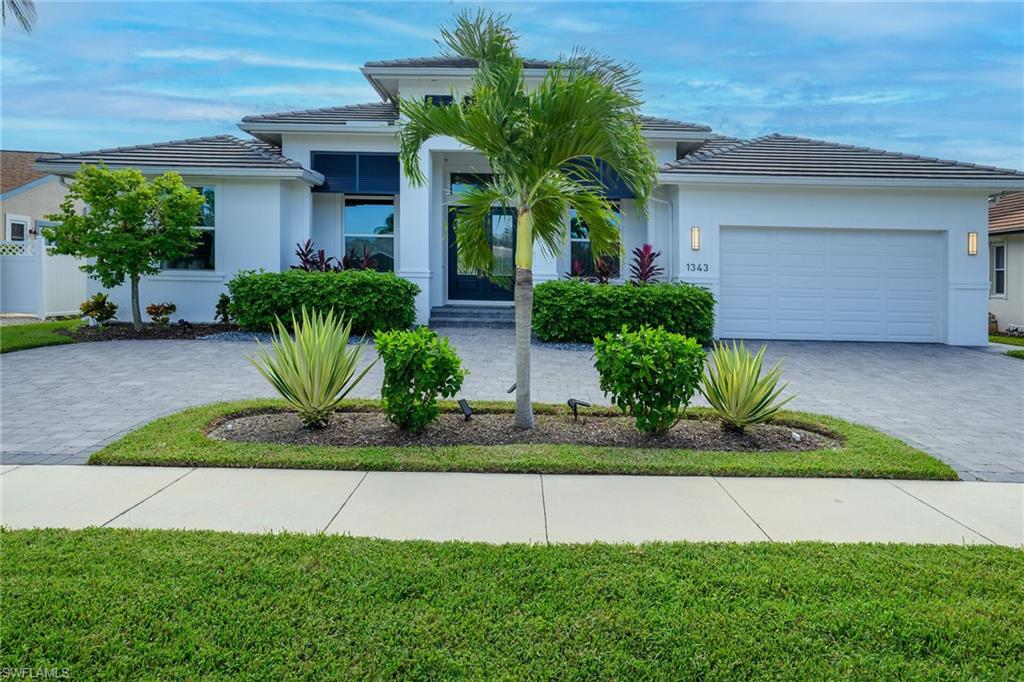 This beautiful, coastal style home is full of upgrades. This Captiva floorplan, built by FCI Homes Inc in 2022 includes 3 bedrooms, 3 bathrooms, large great room, kitchen with Bosch appliances, dining area overlooking the pool, a study and flex room, spa and has a 2-car garage with a circular driveway. This home boasts high ceilings, 8' sliders, impact windows, outdoor summer kitchen, and covered lanai. The bright, open concept design includes upgraded kitchen cabinets, quartz countertops, large island, walk-in pantry, and tile flooring throughout. The owner's suite has 2 walk-in closets and separate vanities. This beautiful property is located just minutes to the white sand beaches of Marco Island, parks, tennis and pickle ball courts, golf, shopping, dining, schools, and the YMCA.