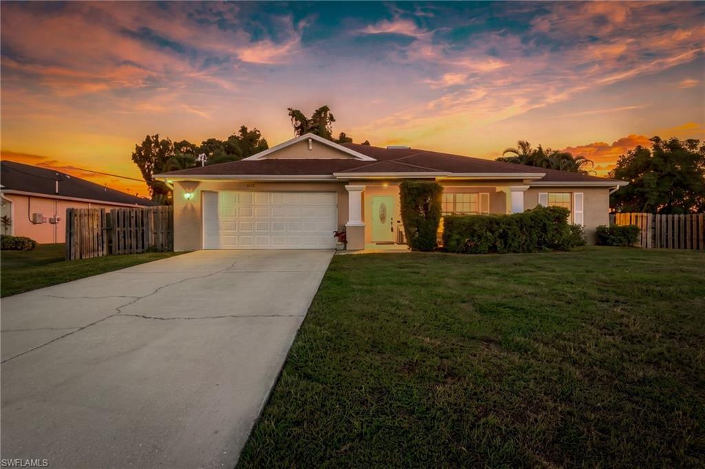 Buckingham Area Beauty…this gorgeous pool home is a MUST see! Spacious layout with 3 bedrooms + den, 2 baths and 2 car garage. Adorable open front porch greets you as you enter the front door. This home is meant for entertaining with a stunning resort style pool, extended lanai, built in patio bar, fenced backyard, exterior fire pit and lush tropical landscaping. Open floor plan with vaulted ceilings, tons of storage, plenty of natural light and a huge den/home office space. Crisp and bright kitchen that offers ample counter space, pantry and custom breakfast bar. Primary suite features walk-in closet, separate tub and shower, dual sinks with lots of vanity space. Two guest bedrooms are a great size with large closets plus both are located on the opposite side of the house from the primary suite. Additional features include new roof, impact windows, crown moulding, large tile installed on a diagonal, interior laundry room and newer washer/dryer. This highly desirable floor plan offers interior functionality as well as an exterior that provides a true private oasis. Claim your piece of paradise with this fantastic home in the sought after Buckingham area!