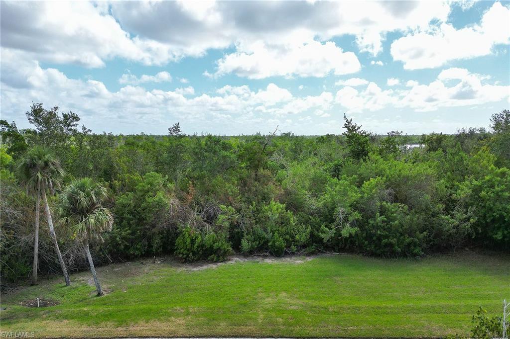 Please see the helpful Key Marco information attached to this listing. One of the most undervalued real estate opportunities in Southwest Florida. Incredible, nearly half-acre lot with panoramic views of Blue Hill Creek, Blue Hill Bay, colorful sunrises and sunsets out to Barfield Bay and the Marco Island skyline from an elevated home. This is the first homesite of the community, so it is extremely private with only one neighbor and is surrounded by lush, mature vegetation. In the prestigious and historic gated community of Key Marco, where you can escape and get away from it all. From the lot, you are less than three miles to Publix, area shopping, hardware store, Walgreens and more and within five miles to Residents' Beach. Enjoy amenities of the community such as ability to have a direct access boat slip with immediate access to incredible fishing, adventure and endless sightseeing among the 10,000 Islands, Gulf of Mexico and beyond and the recently renovated community center with fitness/social rooms and pickleball/tennis. Great homesite for a new build. (Minimum 3,000 air-conditioned square feet, up to 55 feet high). Sellers are Florida licensed real estate agents.