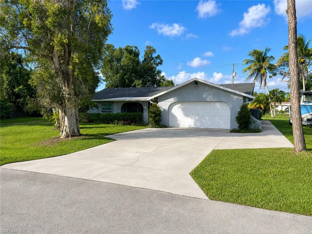 Welcome to 5419 Avenue E, Bokeelia, FL, where island living meets peace of mind. The separately strapped lot to the right (5431 Avenue E) is included in the sale, making it a total of .7 acres. This beautifully updated home offers plenty of room to spread out, entertain, or simply enjoy the tropical surroundings. Mature trees and lush landscaping create a private setting that's hard to find.

Inside, you'll find a bright, open floor plan featuring a stunning remodeled kitchen with quartz countertops, a large center island, custom cabinetry, stainless steel appliances, and designer finishes throughout. The spacious living areas are filled with natural light, while the updated bathrooms and stylish flooring make this home truly move-in ready.

The generously sized bedrooms provide comfortable accommodations, and the flexible floor plan offers space for guests, a home office, or hobbies. Large windows frame beautiful views of the expansive yard, creating a seamless connection between indoor and outdoor living.

Step outside to your own private backyard retreat featuring a sparkling swimming pool and an abundance of green space. The oversized lot provides endless possibilities for gardening, RV or boat parking, additional storage, or future expansion. With Pine Island's world-class fishing, boating, and waterfront restaurants just minutes away, every day feels like a vacation.

For added confidence, this home is equipped with impact-resistant windows, a new roof installed in 2020, and experienced no hurricane damage or flooding, offering buyers exceptional peace of mind.

Whether you're looking for a full-time residence, seasonal getaway, or investment opportunity, 5419 Avenue E delivers the charm of Old Florida with modern updates in one of Pine Island's most desirable locations.