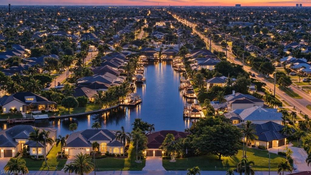 GULF ACCESS. PRIVATE POOL. NO HOA. AND A BREATHTAKING 300+ FOOT VIEW STRAIGHT DOWN THE CANAL! This is the Cape Coral waterfront lifestyle you have been waiting for. Welcome to 4725 SW 23rd Ave, offering 3 bedrooms, a large den, 2 full bathrooms, 1 half bathroom, and 2,268 square feet of spacious Florida living. The flexible floor plan provides plenty of room for everyday living and entertaining, while the oversized den is perfect for a home office, media room, or additional guest space. Step outside and you will immediately see what makes this property so special. Your private waterfront retreat features a screened pool, outdoor shower, and expansive canal views that create an incredible backdrop for morning coffee, pool days, sunset drinks, and entertaining. A CONCRETE DOCK puts the boating lifestyle directly in your backyard, with convenient access to the Gulf of Mexico. Buyers will also appreciate the major improvements already completed, including a NEW METAL ROOF in 2023, NEW HVAC in 2021, and NEW PVC PLUMBING AND WATER SYSTEM in 2025. Additional updates include fresh interior and exterior paint, a new pool filter, new door hardware throughout, and recently completed tile and grout work. A recent home inspection has also been completed, providing additional peace of mind. Other highlights include a stucco exterior, 2-car garage, CITY WATER AND SEWER, and ALL ASSESSMENTS PAID IN FULL. Best of all, there is NO HOA, making this an excellent option for a primary residence, seasonal retreat, or investment property. Located just minutes from the shopping, dining, and entertainment along Cape Coral Parkway, with convenient access to Fort Myers Beach, Sanibel Island, and everything Southwest Florida has to offer. PRICED TO SELL by a MOTIVATED SELLER—schedule your private showing today before this exceptional Gulf-access opportunity is gone! VIRTUAL STAGING DISCLOSURE: Select photographs have been virtually staged for illustrative purposes. Each virtually staged image is clearly labeled on the photograph.