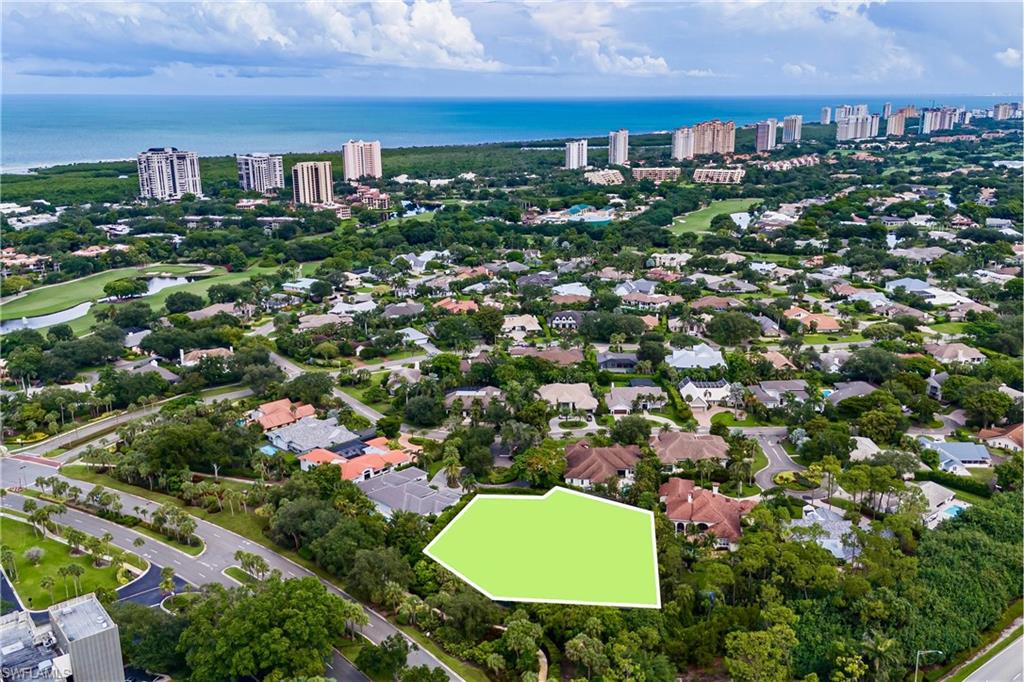 Rare 1-Acre Pelican Bay Estate Lot – The Ultimate Family Compound. Unrivaled scale meets coastal luxury at 808 Whimbrel Ct. This is a once-in-a-lifetime opportunity to build your dream multi-generational compound on a private cul-de-sac lot offering an acre of exceptional privacy. Conceptual plans by renowned architectural firm Stofft Cooney are available and have passed initial design review. While standard Pelican Bay lots average closer to one-third of an acre, this sprawling property delivers estate size proportions, paired with the world-class lifestyle of Naples' premier beachfront community. Ideally located within walking distance to Waterside Shops and Artis—Naples, it provides immediate access to nature paths and mangrove boardwalks. Members enjoy access to three miles of white sand beaches via walking, biking, or open-air boardwalk trams. Exceptional beach amenities feature attendants who set up complimentary lounge chairs and umbrellas, plus assistance with canoes and kayaks. The premier lifestyle features private beachfront restaurants, open-air bars, a fitness center, tennis, and pickleball. Build your legacy estate with unmatched privacy and space.