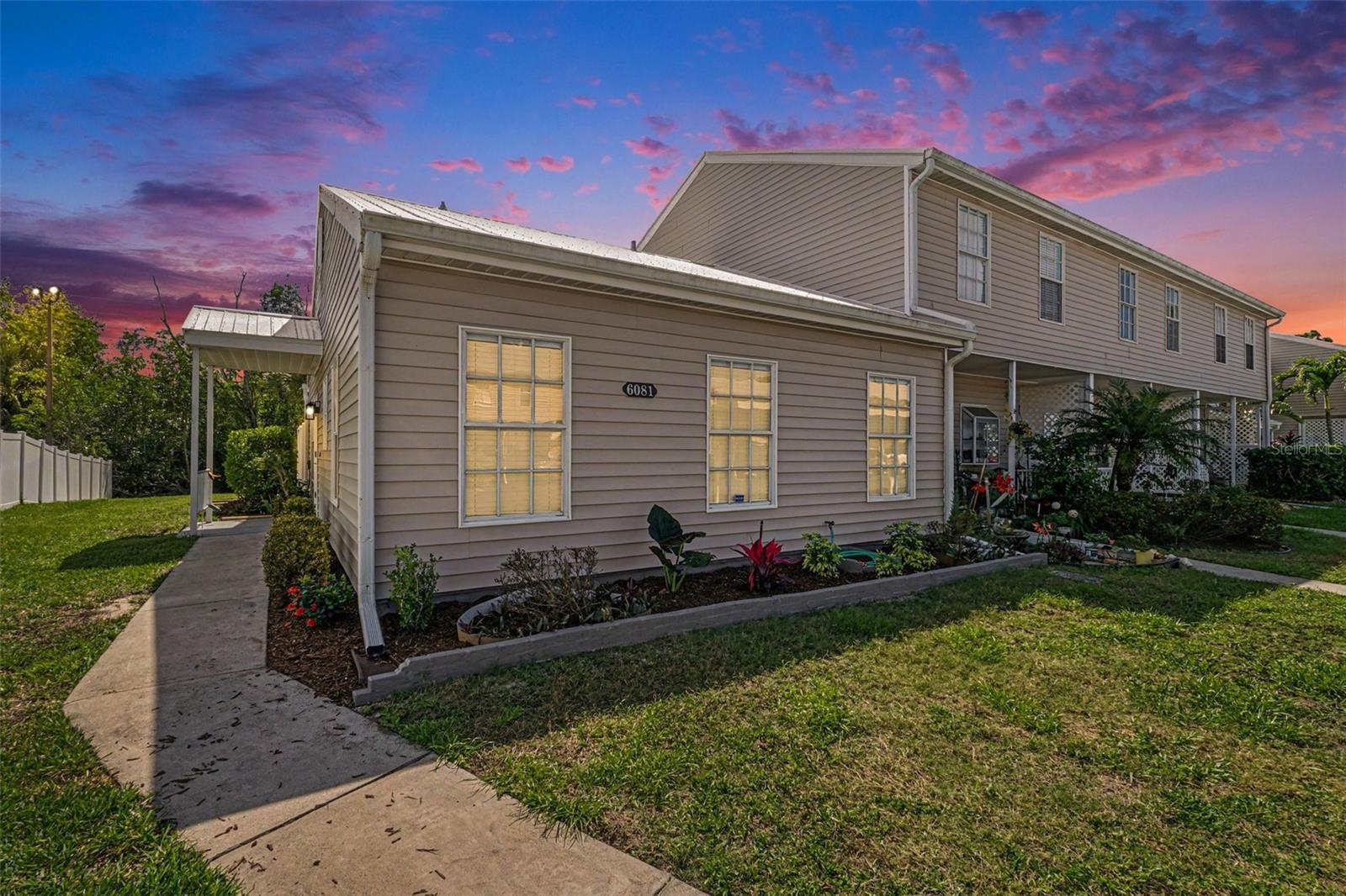 Virtually Staged. Calling all boaters—spend your weekends on the water, not renovating! This beautifully and tastefully renovated 2-bedroom, 2-bath end-unit condominium in Island Park Woods combines move-in-ready comfort with an affordable Florida boating lifestyle. Enjoy a community boat ramp, Gulf access, optional boat storage, a community pool, and pickleball. The association maintains a master flood insurance policy, and a one-year home warranty is offered with the purchase. This townhome-style residence offers added privacy and the comfortable feel of a single-family home. The updated kitchen features quartz-look countertops, upgraded soft-close cabinetry with lazy-Susan storage, and new Samsung and LG stainless-steel appliances. A stackable washer and dryer are included. Wood-look plank tile flows throughout the home and continues onto the enclosed lanai. French doors open to a private, fenced backyard area overlooking the peaceful preserve—an inviting setting for morning coffee, outdoor dining, or unwinding after a day on the water. Both renovated bathrooms feature modern finishes and updated shower enclosures. Additional highlights include fresh interior paint, a newer water heater, convenient attic storage, and a new metal roof. Cool off in the pool, play pickleball, or take advantage of the boating amenities. Boat and trailer storage is available for $200 annually plus a $50 refundable key deposit, subject to availability, size restrictions, and association approval. Buyers should verify the master flood policy’s coverage, deductibles, and individual insurance needs. The one-year home warranty is subject to plan terms. Convenient to shopping, dining, RSW International Airport, Fort Myers Beach, and Sanibel Island, this inviting home is ready for year-round living or a seasonal escape. Your next chapter could include more sunshine and more time on the water—schedule your private showing today! Some photos have been virtually staged to illustrate potential furniture placement and décor.