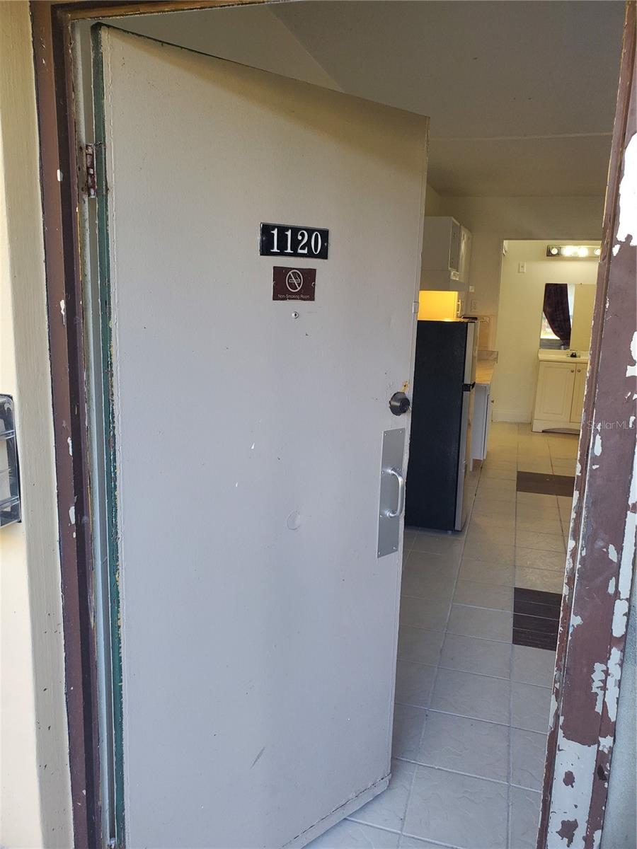Unfurnished 1 bedroom efficiency with refrigerator and air conditioner with room for a kitchenette. Unit is rented and the lease expires January 31, 2027. Rent is $975 per month. HOA includes: water, electricity, cable tv, trash removal and security. Near shopping, restaurants, attractions, and airport. Agent is the owner.