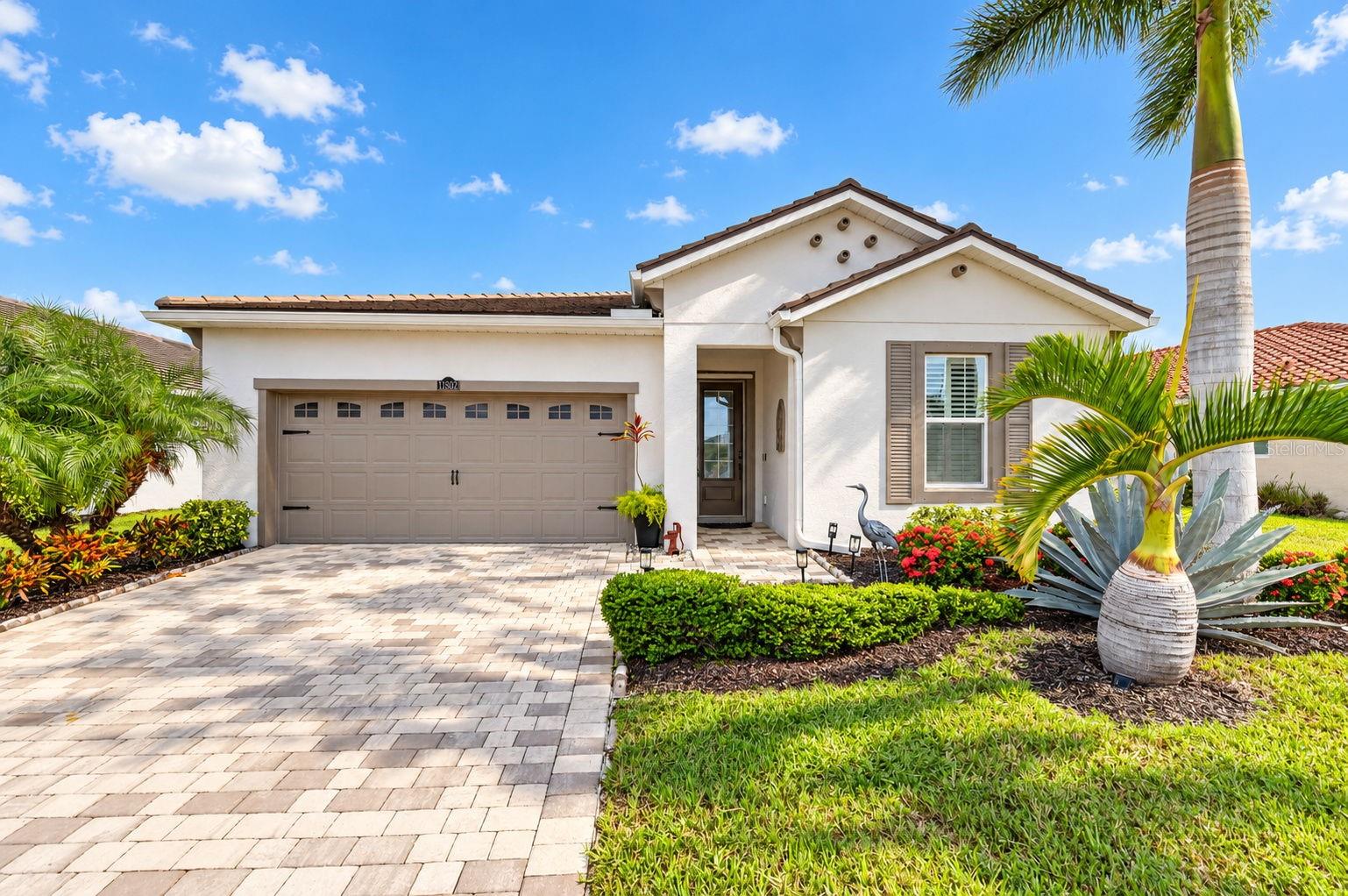 BEAUTIFUL WATER VIEWS, ADDED PRIVACY, AND THOUGHTFUL QUALITY UPGRADES come together in this beautifully maintained, semi-custom 3-bedroom, 2-bath home featuring a distinctive Coastal Mediterranean elevation in the sought-after, gated community of Renaissance at Wellen Park. Offering the appeal of a nearly new home without the wait for new construction. This residence is truly in like-new condition, with quality upgrades, meticulous care, and a fresh, move-in-ready feel. Why wait to build when you can enjoy a completed home with desirable upgrades already in place? Situated on a desirable premium homesite with expansive water views, this home features additional space and privacy of a larger lot, a spacious fenced backyard available for your new inground pool, professionally installed lush tropical landscaping, and an extended screened lanai with clear view screen overlooking tranquil waters. Step inside to discover a freshly painted interior (less than one year), surrounded by custom crown molding throughout. This home features 8-foot doors, high-profile baseboards, plantation shutters, and premium porcelain tile flooring throughout the main living areas, primary suite, and third bedroom. The beautifully appointed kitchen showcases quartz and granite countertops, white cabinetry with pull-out shelving, a large contrasting rich wood-tone island, upgraded stainless steel appliances, walk-in pantry, and deep storage drawers. The spacious primary suite features a tray ceiling, an expansive walk-in closet, separate dual vanities, additional bathroom cabinetry, and a beautiful wall-to-ceiling tiled shower. The third bedroom offers a convenient Murphy bed providing flexibility for family, guests, or a home office. Additional highlights include a glass front entry door with retractable screen, laundry cabinetry, a spacious two-car garage with epoxy-coated flooring, utility sink, and additional storage, storm/hurricane shutters for all windows and doors, and whole-house surge protection. Enjoy resort-style living with Renaissance amenities, including a heated zero-entry pool with lap lanes, spa, clubhouse, fitness center, tennis, pickleball, bocce, and access to scenic walking trails and Blue Heron Dog Park, and organized social activities and opportunities for residents of all ages. Ideally located in close proximity to Downtown Wellen Park, shopping, dining, golf courses, entertainment, and multiple Gulf Coast beaches, this exceptional home combines the comfort and appeal of like-new construction with the benefit of an established, beautifully maintained residence, without the wait and inconvenience of building. Enjoy the upgrades, water views, privacy, and Florida lifestyle you've been looking for. Ready to enjoy from day one. Don't delay, schedule your showing today!