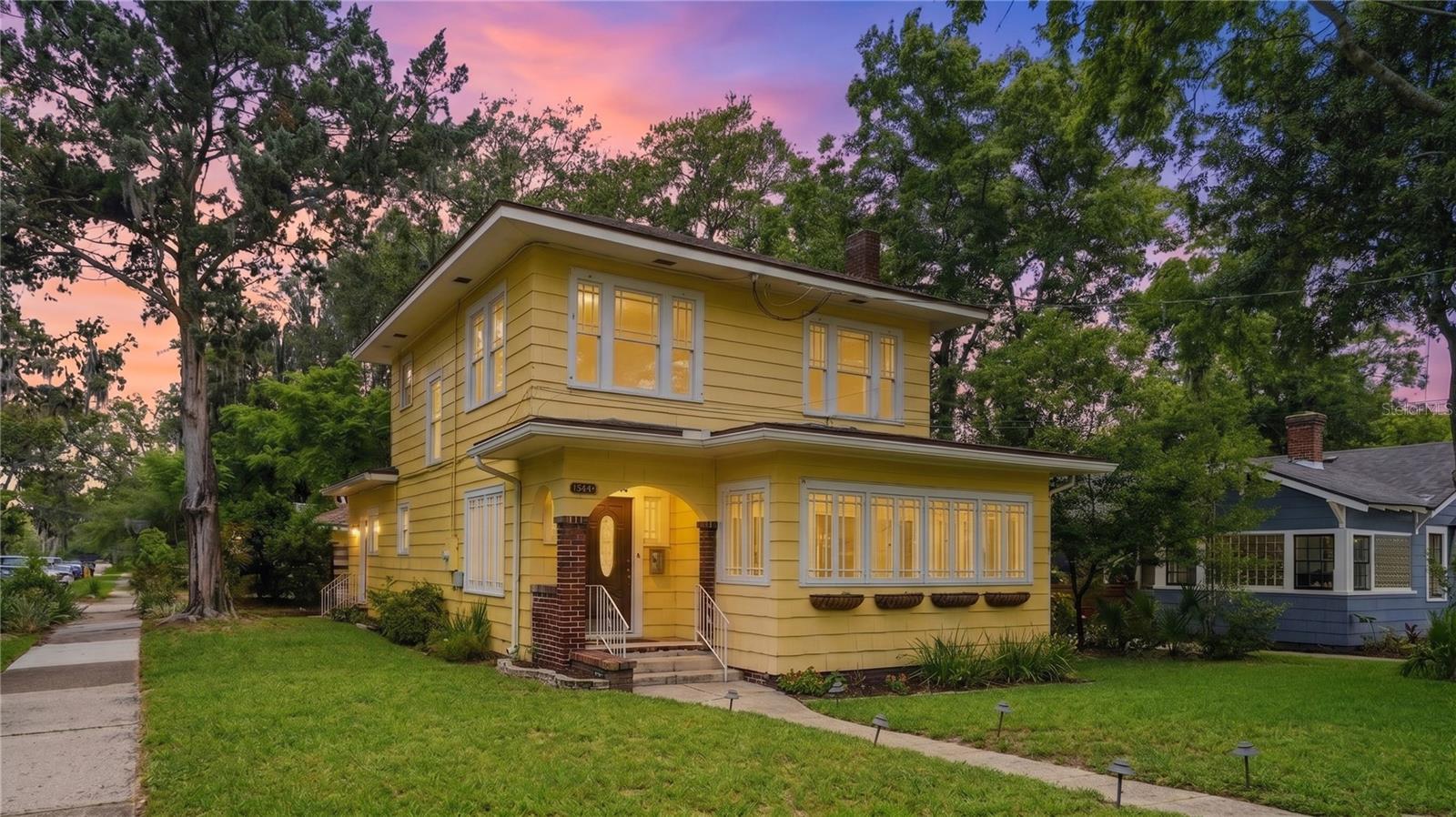 Historic soul. Modern comfort. A century of stories—ready for its next chapter.A rare opportunity to own a piece of Avondale history, this iconic 1925 Prairie-style home celebrates 100 years of timeless architecture, enduring craftsmanship, and unmatched character. More than a home, this is a lifestyle defined by history, charm, and community. Enjoy the unparalleled walkability of historic Avondale, where beloved restaurants, boutiques, parks, and the St. Johns River are all moments from your doorstep. Offering 3 bedrooms, 2 full bathrooms, a two-car detached garage with 2,202 square feet, this exceptional residence seamlessly blends historic elegance with modern comfort in one of Jacksonville’s most coveted neighborhoods. From the moment you enter, the home’s original charm is unmistakable. Rich oak inlay hardwood floors, an ornate fireplace, picture molding, French doors, and graceful arched openings create warmth, sophistication, and architectural beauty rarely found today. At the heart of the home, the thoughtfully designed kitchen is both stylish and functional, featuring solid-wood cabinetry, a brand-new fridge, a wine refrigerator, expansive island seating, and a classic tucked-away pantry. The kitchen opens effortlessly to a welcoming secondary living room, creating an inviting space for effortless entertaining. Host unforgettable dinners in the elegant formal dining room, then unwind in the stunning living room that flows into a sun-drenched bonus space—perfect as a private office, creative studio, library, or relaxing retreat.Outside, an enchanting backyard oasis awaits. A large fenced yard illuminated by twinkling café lights and anchored by a brand-new entertaining deck offers the perfect backdrop for al fresco dinners, weekend gatherings, or quiet evenings under the stars. An encapsulated crawl space enhances efficiency and comfort, while the detached two-car garage with yard access and additional storage. NEW ROOF 2025! UPDATED SEWER LINE 2025.
.
 All information pertaining to the property is deemed reliable, but not guaranteed. Information to be verified by the Buyer. Be advised that cameras may exist recording audio and video inside/outside the property, such as ring doorbells. Photos are digitally enhanced and could be altered, please verify.