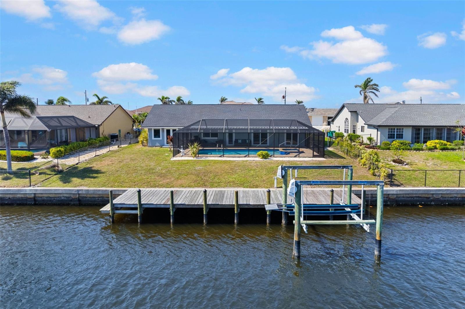 **WATERFRONT • SAILBOAT WATER • POOL & SPA • BOAT LIFT • COMPLETELY RENOVATED • HIGH & DRY — NO HISTORY OF FLOODING OR WATER DAMAGE!

Welcome to **4196 Eastlake Court**, an exceptional waterfront pool home offering the best of the Florida lifestyle. Nestled on a quiet cul-de-sac in a desirable Port Charlotte boating community, this beautifully renovated residence combines lovely modern finishes with direct access to the open water.

From the moment you enter, you'll appreciate the spacious, light-filled layout and impeccable attention to detail. The home features 3  bedrooms, 2 full bathrooms, and an oversized 2-car garage. Completely renovated from top to bottom, it offers the rare combination of style, comfort, and peace of mind.

The stunning gourmet kitchen is designed for both entertaining and everyday living, featuring a large center island, elegant quartz countertops, soft-close cabinetry, new stainless-steel appliances, and a wine refrigerator. The open-concept living spaces create an inviting atmosphere for entertaining family and friends.

Major improvements include a newer roof, newer A/C system, and hurricane-impact windows and sliders, adding to the home's value and providing additional peace of mind.

Step outside and discover your own private waterfront retreat. With approximately 80 feet of waterfront, a private dock, and boat lift, this property is a true boater's paradise. Enjoy the beautiful heated pool and spa, expansive screened lanai,  while taking in peaceful canal views.

Best of all, the sailboat-water canal provides direct boating access, allowing you to leave your dock and cruise toward the harbor and out toward the Gulf of America. Whether you're an avid boater, fisherman, or simply love being near the water, this location offers an incredible opportunity to enjoy Southwest Florida from your own backyard.

Located close to beautiful beaches, waterfront dining, shopping, golf, fishing, and endless recreational opportunities, this home puts everything you love about Southwest Florida within easy reach.

This is more than a home — it's a lifestyle. Relax poolside, entertain under the lanai, take the boat out for an afternoon on the water, and return home to your own private waterfront oasis.