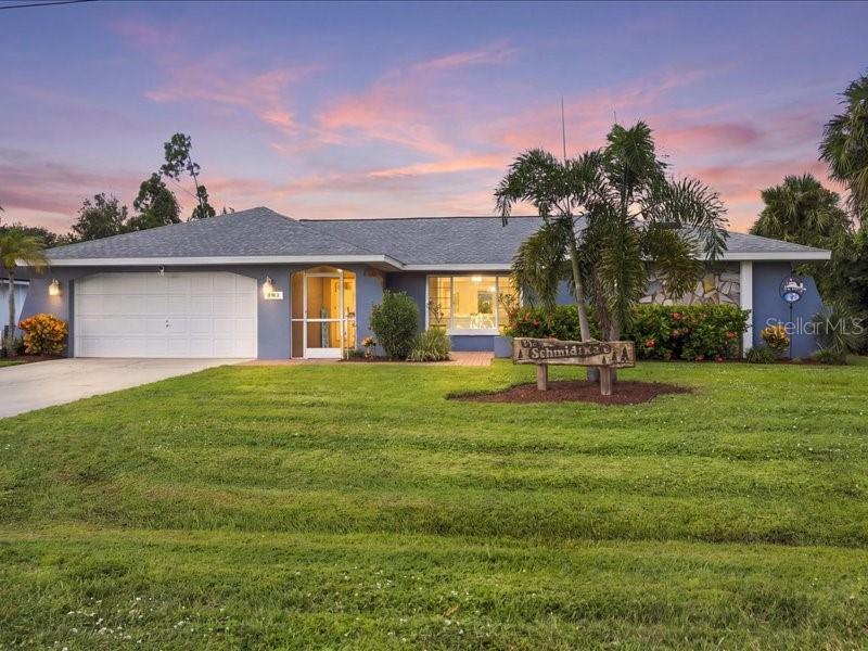 Welcome to 393 Malpelo Avenue, a beautifully maintained 3-bedroom, 3-bath pool home with a 2-car garage, located on a quiet street in Punta Gorda’s desirable Deep Creek Section 20 community. Stellar curb appeal with an additional wooded lot available providing extra privacy, spacious living areas, and a wonderful outdoor entertaining space, this home offers the comfort, flexibility, and the Florida lifestyle you’ve been looking for. From the moment you arrive, you’ll appreciate the attractive landscaping, brick-paver courtyard, screened entry, and welcoming French doors. Inside, vaulted ceilings and abundant natural light create an open, comfortable atmosphere. The unique and thoughtfully designed floor plan features a formal living room, separate family room, dining area, a spacious kitchen, and an eat-in breakfast room, giving everyone plenty of room to gather or enjoy their own space. Five hurricane rated sliding glass doors, including two pocket sliders, provide easy access to the covered lanai and pool area, bringing indoor and outdoor living together. The kitchen features granite countertops, tiled backsplash, wood cabinetry, stainless steel appliances, a pantry, and plenty of room for everyday cooking and entertaining. Tile flooring throughout the main living areas, tall baseboards, updated lighting, and Hunter ceiling fans add to the home’s appeal. The generously sized primary suite offers plenty of room for a sitting area, two walk-in closets, and a private bathroom featuring granite countertops, a soaking tub, separate walk-in shower, and skylight. Two additional bedrooms provide comfortable space for guests, family, or a home office, with one offering direct access to the pool area. Serenity of outdoor living is where this home really shines. The expansive covered lanai offers plenty of space for dining, entertaining, or simply relaxing beside the PebbleTec saltwater pool. A convenient pool bath, Lanai PRIVACY SCREENING, and fenced backyard make the space as functional as it is enjoyable. The adjoining wooded lot (available for purchase), adds another level of privacy and gives the property a sense of openness that’s difficult to find. A Wi-Fi-enabled variable-speed pool pump and pool lighting provide added convenience. Beyond its inviting layout and outdoor living space, this home offers an impressive list of improvements, including a NEW ROOF (2023), HVAC (2020), Whole Home hurricane-impact windows (2024), PebbleTec pool resurfacing (2024), New pool cage (2024), exterior painting (2024), water heater (2025), and updated pool equipment (2026). Hurricane-rated exterior doors and an installed security 6 camera system offer additional practical benefits. Built in 1989, this home combines the spacious floor plan and character of an established Florida residence with many of the important updates buyers appreciate today. Conveniently located near I-75, PUNTA GORDA AIRPORT, SunSeeker Resort, shopping, restaurants, golf courses, and everyday amenities, you’re also just a short drive from historic downtown Punta Gorda, Fishermen’s Village, Charlotte Harbor, and all the recreation Southwest Florida has to offer. What makes 393 Malpelo Avenue special isn’t just what’s inside the home. It’s the space, privacy, and opportunity to enjoy Florida living both indoors and out. This Deep Creek home wont last. Come see it for yourself. Schedule your private showing today!