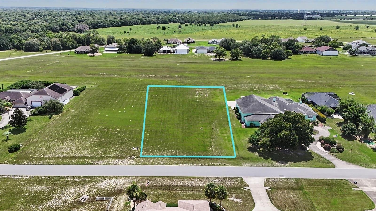 Primary picture shows lot plotted on it (other pics do not). Welcome to Leeward Air Ranch (FD04), one of America's favorite private, gated, sport aviation communities, where aviation is more than a passion—it’s a way of life, offering the ultimate living-with-your-plane experience for private pilots seeking an active flying community with a vibrant, casual social environment, offering around 300 flying days a year. Build your dream home and hangar on the ONLY Runway frontage lot available, featuring over a 1 acre space (150' wide x 312' deep). You will enjoy direct access to the heart of Leeward Air Ranch (lot is conveniently located just south of the Runway 18 Threshold), and the "Red Barn" Community Center is only a few houses to the south. Imagine unfettered access to your 6,250' by 165' reinforced, lighted, all-weather VFR turf runway that Mac McClellan of Flying Magazine calls "... the most perfectly constructed and maintained turf runway...". With almost 200 hangar homes and aircraft calling it  home, it won’t take long to meet your new lifelong friends. What’s not to love about the famous “Red Barn”, Fly-ins, Warbird roundups, aviation days, Aerobatic demos, Friends and Family Breakfast fly-ins, holiday events, light up Leeward parade. Regular fly-outs, hangar happy hours, movie nights, motorcycle rides, bridge club, poker nights, yoga, book club, art club, etc. Think warbirds, antiques, classics, light sports, home-builts, kit planes, aerobatics (ask about IAC practice area!), amphibs, helicopters, gliders, and the list goes on. EAA, IAC, QB, Warbirds of America, 99's, Humble Squadron, Florida Aero Club, Florida Antique Biplane Association, Intl 180/185 club. Restaurants, shopping, access to health care nearby. Whether you're flying around the patch, lifting off for an adventure, enjoying the camaraderie of your newfound friends and their flying machines, Your search is over for the perfect blend of lifestyle and functionality. Pilot’s license and aircraft ownership required. 1800 SF minimum living area home, along with hangar built at same time required. This is an open Builder lot, and there is no time restriction to build. Plans and Construction available (contact listing agent).