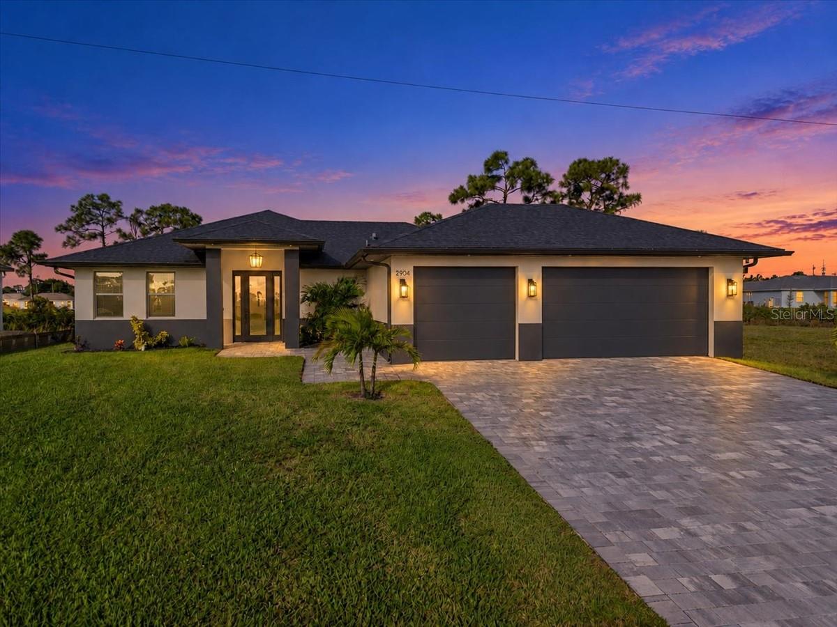 Welcome to your dream home! Built in 2023, this gorgeous 3-bedroom plus den, 2-bath, 3-car garage pool home offers 1,657 sq. ft. of pristine waterfront living in Northwest Cape Coral.
Step through the 8’ glass front door into a bright, open-concept main living area featuring 8’ interior doors, a dedicated TV alcove, and durable, pet-friendly wood-look tile flooring throughout. The open office/den boasts double windows for abundant natural light and custom wall-to-wall built-in cabinetry.
The heart of the home is a modern farmhouse kitchen complete with premium white quartz countertops, grey and white shaker slow-close solid wood cabinetry, a timeless herringbone backsplash, black hardware, and fingerprint-resistant black stainless LG appliances. A functional interior laundry room sits just off the kitchen, featuring an expansive pantry/storage closet with the washer and dryer included.
The private master suite is a true retreat, styled with custom over-the-bedside ceiling-mounted lighting, a spacious walk-in closet, and an oversized shower. Generously sized guest bedrooms feature ample storage with solid wood shelving, while the guest bathroom conveniently doubles as a pool bath.
Step outside to your private oasis. The screen-enclosed pool features a tanning shelf and a sprawling paver deck stretching the entire length of the home—perfect for entertaining and enjoying breathtaking western sunset views. Enjoy direct access to the 79’-wide Lucifer Canal right from your backyard, perfect for kayaking and fishing.
Premium Upgrades & Security:
• Storm & Energy Prep: Full hurricane impact windows and doors, Panorama Solar Guard window tinting, and a manual generator transfer switch.
• Utilities: Whole-house reverse osmosis water system with a 160’ deep well and a new submersible pump.
• Security: Hard-wired security system with Bluetooth-capable monitoring screens.
• Garage: Over-sized 3-car garage equipped with an 11’ Husky steel organizer, stainless steel countertops, and self-closing, locking doors.
Located in a quiet, highly desirable NW Cape Coral neighborhood just south of Freedom Acres. Best of all, this property sits in a preferred non-flood zone (No flood insurance required)! Schedule your private tour today!