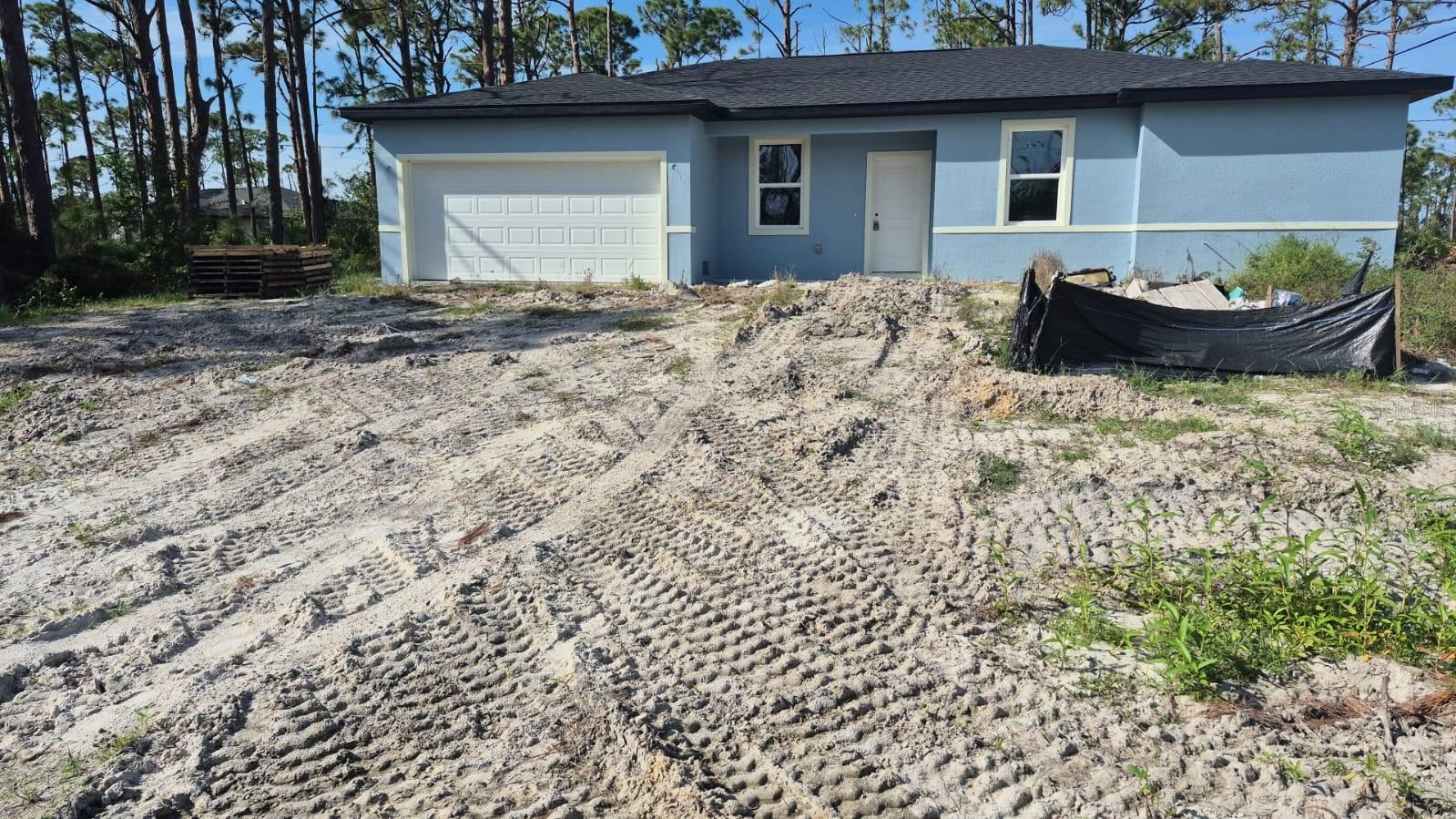 Under Construction. The property’s price is based on the current stage of construction, which is 0.83/100 of completion. This property has an active and transferable building permit. Electrical, plumbing, and HVAC systems are already completed, and the structure is in an advanced stage of construction—ready to be finished to the new owner’s specifications. If the buyer wants to finish the construction with our builder we have a preferred lender to provide financing and the remaining cost is $53,575. This stunning new home will feature 4 bedrooms and 2 bathrooms in a peaceful, well-located neighborhood, with an attached 2-car garage and elegant paver driveway. The smart two-way split floor plan offers privacy and comfort, with modern waterproof vinyl flooring throughout. The open-concept kitchen includes granite countertops, upgraded cabinets, and a stylish backsplash—ideal for both daily living and entertaining. The master suite provides a spacious retreat with a walk-in closet. No HOA, no CDD, and no restrictions—experience the freedom to make this home truly yours. A prime opportunity for investors and homeowners alike!