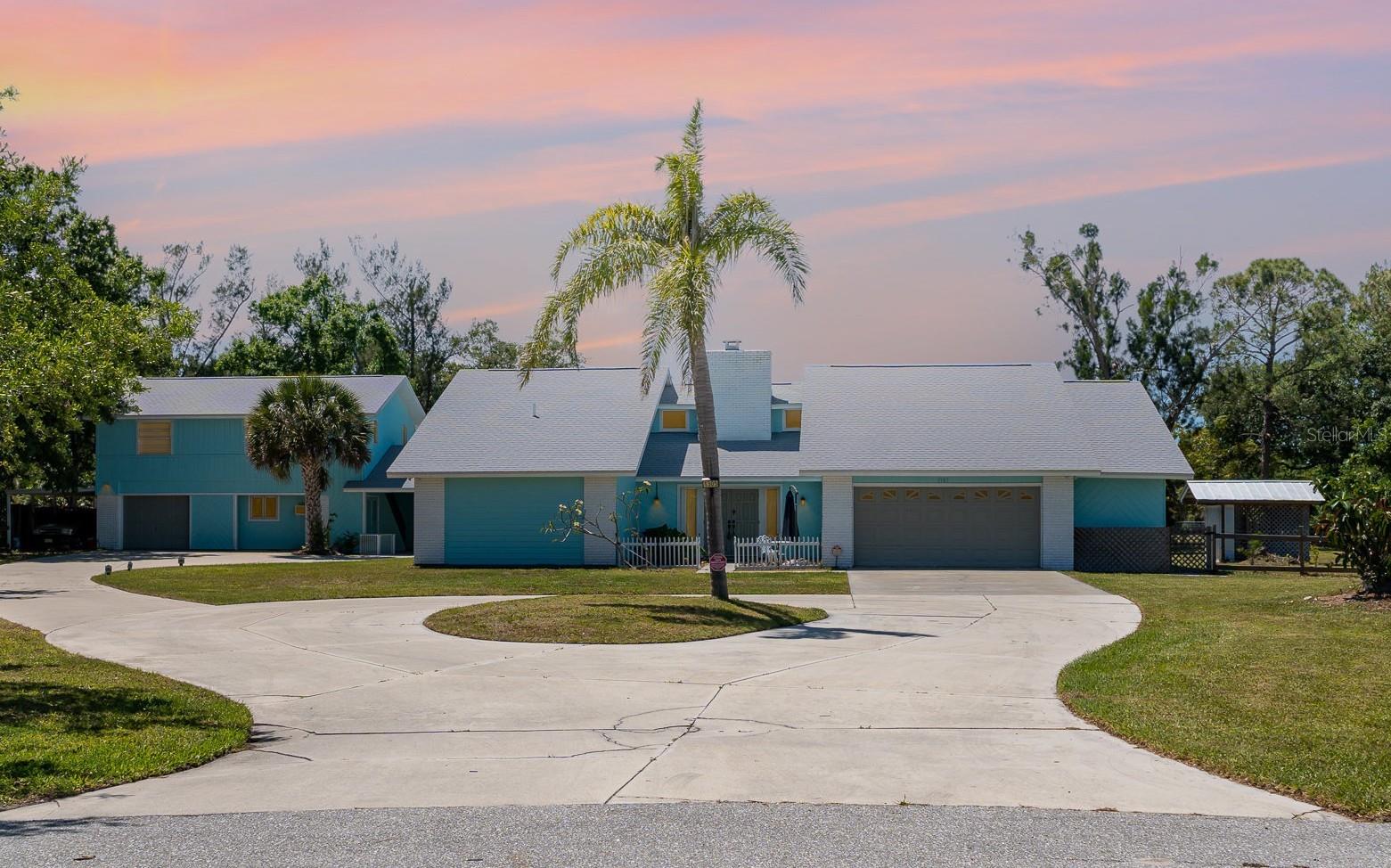 VENICE ACRES FAMILY COMPOUND OVERVIEW
   This is an exceptional Venice Acres family compound with two houses ( 5 bedrooms, 5 bathrooms plus studio apt.) on over 1 acre of land on peaceful cul-de-sac. Set in a country environment, yet so close to restaurants, shopping, medical, 4 miles to Downtown Venice, and of course close to the gorgeous beaches of Venice! This property offers a wealth of living space for an extended family or those seeking comfort and versatility.
MAIN HOME FEATURES
  The main home has  3 spacious bedrooms and 3 full baths. The Primary suite has both a walk in closet and second closet. The primary bath was recently updated and has access to the pool area.  The second and third bedrooms are of generous size and have a large bathroom between them.  The expansive eat in kitchen has a central island, new stone countertops, abundant cabinetry, making it perfect for entertaining and family gatherings.  The family room has vaulted ceilings and a wood burning fireplace with sliders to the back porch and screened pool area with newer hot tub.  The living room leads to an inside laundry area and a third full bath with direct access to outside.  The oversized 2 car garage includes an additional bonus room, perfect for hobbies or extra storage.
 GUEST HOUSE
 The guest home is connected via large covered porch to the pool area and main home. Upstairs you will find a wonderful 2 bedroom 1 bath guest home with vaulted ceilings, full kitchen, perfect for your guests or the in-laws!  Downstairs you will find a studio apartment with full bath and kitchenette. The is also and 1 car garage and a newly renovated carport which can also serve as a stable for your horse. 
 OUTDOOR SPACE
  The property features a large circular driveway and a fully fenced backyard.  There is plenty of room for your boats, jet skis, RVs, classic cars, making this property perfect for the active family or hobby enthusiasts. The large backyard has room for your garden or fruit tree grove. There is also room to build a large workshop if desired. 
 RECENT UPGRADES
 New Roofs on both the main home and guest house in 2023.  New well and Reverse Osmosis for all of the homes in 2024.
 Since 2021 All Electric Panels have been updated complete with hookup for a generator.  Since 2021 new fencing, new refrigerators, renovated horse stable/carport, fresh paint inside and out. Access to Ultra High Speed Internet  (up to 7,000 Mbps)
 ENDLESS POSSIBILITIES SUMMARY
  This unique property with 2 homes on over 1 acres of land with 5 bedrooms, 5 full baths, and a studio apartment connected by large porch with access to pool and hot tub!!!  Room for a large garden or out building in the  large pie shaped back yard. Plenty of space for your boats, jet skis, RVs, classic cars, perfect for  active families and extended families. Did I mention location, location ,location!!! Located only 4 miles to downtown Venice and 6 miles to the gorgeous beaches of Venice! 
The Sarasota Airport is just 20 miles away ensuring connectivity for both business and leisure. 
MAKE THIS VALUE AND UNIQUE PROPERTY THE PARADISE YOU ALWAYS DREAMED !!!