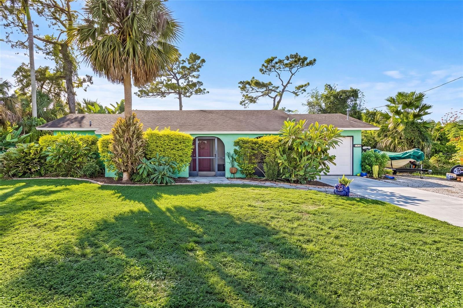 LAKE GEORGIA WATERFRONT LIVING, NO HOA & FLOOD ZONE X! Welcome to 184 Karlow Avenue, where beautiful lake views, tropical landscaping, and the Southwest Florida lifestyle come together!

Nestled in Twin Lakes Estates, this charming 2-bedroom, 2-bathroom home offers 1,056 square feet of living space, a desirable split-bedroom floor plan, an attached one-car garage, and a picturesque lakefront setting on almost quarter-acre lot (.24 acres).

Inside, enjoy a welcoming living, an eat-in kitchen with updated countertops, tile flooring, and sliding glass doors leading to a screened lanai overlooking beautiful Lake Georgia.

THE REAL SHOWSTOPPER? THE BACKYARD! Imagine sipping your morning coffee while enjoying peaceful water views, spending your afternoons kayaking or paddleboarding on the lake, or unwinding as the evening sky reflects across the water. This outdoor oasis features mature trees, lush tropical landscaping, charming garden beds, and an expansive lawn stretching toward the water’s edge. Whether entertaining friends or simply enjoying nature, this backyard delivers the Florida lifestyle you’ve been dreaming of!

EVEN BETTER? NO HOA & FLOOD ZONE X! Enjoy waterfront living without HOA fees, along with the added benefit of being located in a flood zone X.

Whether you’re looking for a full-time residence, seasonal escape, or investment opportunity, this lakefront gem offers the perfect combination of comfort, charm, and outdoor adventure.

WHY SETTLE FOR AN ORDINARY BACKYARD WHEN YOU CAN HAVE LAKE GEORGIA AS YOUR BACKDROP?

***Exclusive Incentive: With an accepted contract and the use of the seller's preferred lender, enjoy a 1/0 BUYDOWN ON FINANCING. This fantastic benefit lowers your mortgage rate by one full point in the first year, providing significant savings and reduced initial monthly payments.***