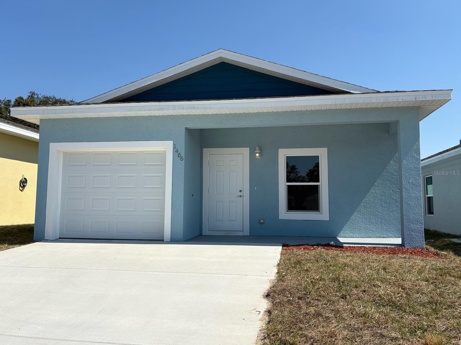 Brand-new construction concrete block home offering affordable modern luxury in the secure, gated community of Las Villas in Sebring! This move-in-ready 3-bedroom, 2-bathroom residence features a private driveway and attached garage. BIG DOUBLE DRIVEWAY.  Step inside to soaring 9.4-foot ceilings with bright recessed lighting, high-quality luxury vinyl plank flooring throughout, and elegant marble-look tile in the bathrooms. The gourmet kitchen boasts soft-close cabinetry, a 4-piece stainless steel appliance package including a double-door refrigerator, and quartz countertop . Comfort and peace of mind come standard with A/C and ceiling fans in every room, installed surge protectors, and the convenience of main sewer service with no septic hassle. Las Villas residents enjoy private streets, electric gate access, a playground, and a recently refurbished community swimming pool. Prime location near Lake Jackson, top schools, shopping, dining, Highlands Regional Hospital, downtown city services, and the famous Sebring International Raceway, plus nearby fishing, golf, and watersports. Centrally located roughly 1 hour from Lakeland and 1.5 hours from both Orlando and Tampa. Schedule your showing today!