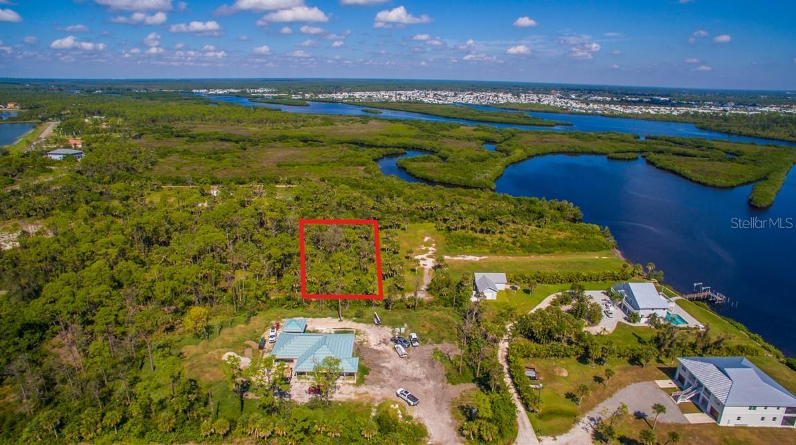 Imagine the freedom to design your own private waterfront retreat—nestled along a tranquil canal that leads directly to the Myakka River and the Gulf of Mexico through the El Jobean Bridge. This 1.0033-acre parcel on Deer Court in Venice offers approximately 153 feet of canal frontage -- perfect for boating enthusiasts seeking Gulf access and tranquil water views. With NO HOA and NO CDD, you have full freedom to bring your vision to life. Just the serenity of the water and the lifestyle that comes with it. Electricity is nearby, and a private well and septic system will be required. The possibilities are endless—an elegant custom residence, a winter retreat, or even a builder’s showcase in an emerging waterfront enclave. Located less than 15 miles to the Venice Beach and Manasota Key Beach. This is your chance to create a legacy property that combines tranquility, convenience, and adventure. Located near Wellen Park, Myakka Pines Golf Course, Myakka State Forest trails, and CoolToday Park—home of the Atlanta Braves—this canal-front lot is a rare opportunity to own a piece of waterfront paradise in a rapidly developing area. Additional parcels available under MLS# A4670047 and A4670056.
