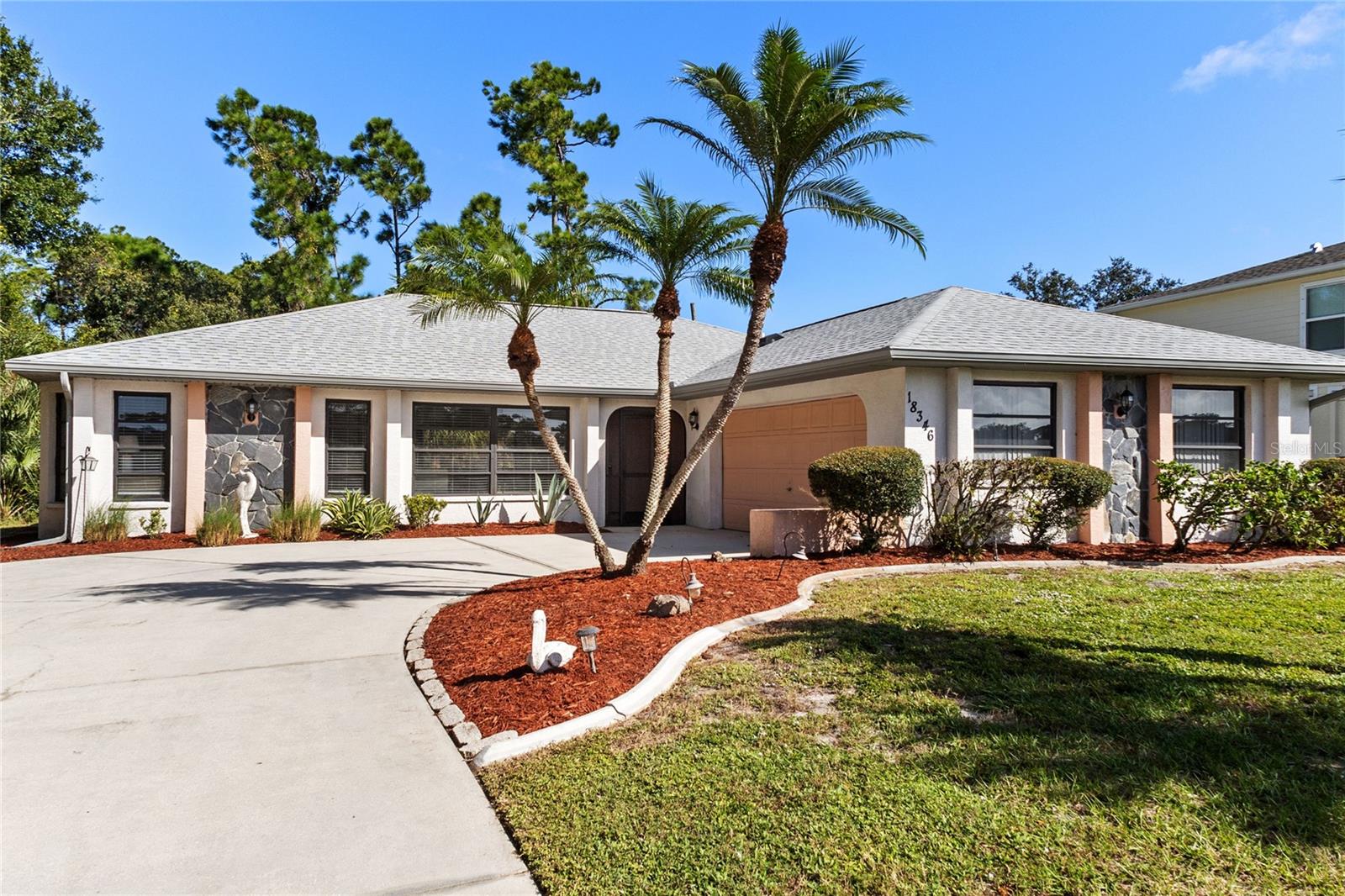 Welcome Home! This beautiful well maintained pool home boasts a bright and airy open floor plan and is being sold furnished. Move right in and start enjoying the Florida lifestyle. When you walk through the screened entryway into the home you will notice the high ceilings, picture window, seamless flow through the house and a wonderful view of the lanai and pool. Walk on to the lanai and take-in the 13X28 heated pool and extended lanai, the ideal area to swim, entertain, relax or grill out for you and your family and friends. The large kitchen has ample cabinet and counter space, breakfast bar, pantry and a dinette area overlooking the pool. This split bedroom floor plan offers plenty of privacy for all. The primary suite has a large walk-in closet and access to the lanai and pool area.  Other features includes ceramic tile in all common areas, new side garage door, new roof in 2022, new Hot Water Heater in 2023, new AC in 2019, cabinets in the laundry room, all items and furnishings included, side load garage, concrete curbing for plant beds around the entire house, and a solar pool cover for the cooler months. Nice and quiet neighborhood to walk or ride your bike and enjoy nature and the wildlife. Convenient location with stores, restaurants, movie theatre, bowling, medical facilities and boat ramp within 3 miles. No HOA. Take a look at this home, you won't be disappointed. Video attached for your viewing pleasure.