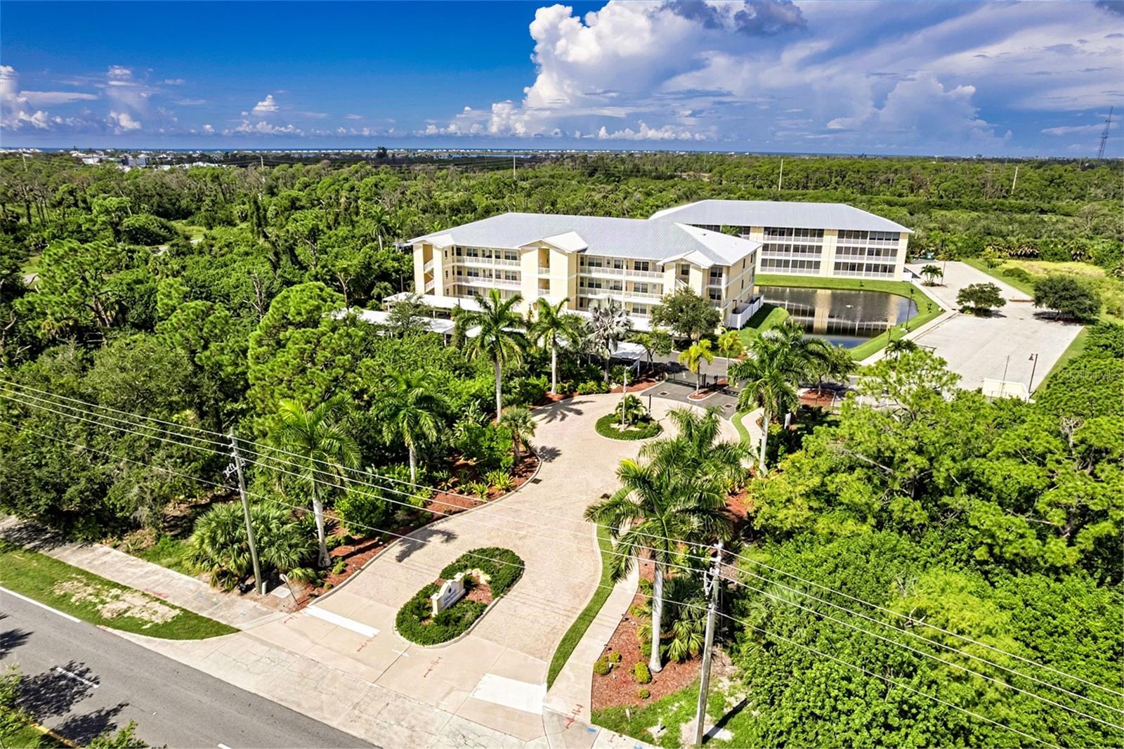 Experience effortless Florida living in this beautifully updated top-floor corner residence nestled within the peaceful, gated Waterside community in Rotonda West. This turnkey home offers 1,525 square feet of light-filled living space. An elevator-accessible home that delivers privacy, comfort, and scenic views. This home has been updated with Stylish Luxury Vinyl Planking throughout, Granite Counter tops, Modern Fixtures, Recessed Lighting, New AC (2026), Water Heater (2025), Refrigerator (2024) and refurbished Kitchen Cabinets (2025). The Primary Bedroom is generously sized with private access to the lanai, a large walk-in closet, and an ensuite bath featuring a dual granite top vanity and a spacious walk-in shower.  The  kitchen is equipped with rich granite countertops, stainless steel appliances, a breakfast bar, and a built-in pantry for ample storage.  Two additional spacious bedrooms create versatility for family, guests, or a dedicated home office. Unwind and take in tranquil pond views and gentle breezes from your screened rear balcony that also has a substantial storage closet. 
Waterside residents enjoy Resort Style Amenities with access to a Club House, heated community pool (pool, pool deck, fencing refurbished 2026) and spa, a lakeside gazebo, social gathering areas, and barbecue grills. Improvements within the community include New Covered Parking on a resurfaced lot with designated parking spots (2026). New Roof, Soffits, Eaves, Downspouts on all buildings (2025). New Fencing and Security Gates (2024) for peace of mind.  There is a feature sheet available for more information on this vibrant community.  
Situated with easy access to Boca Grande and Manasota Key beaches, World-Class Golf Courses, Marinas, Waterfront Dining, and local Shopping. Whether you are looking for a full-time residence, a seasonal getaway, or an investment opportunity, this unit is move-in ready and waiting for you.