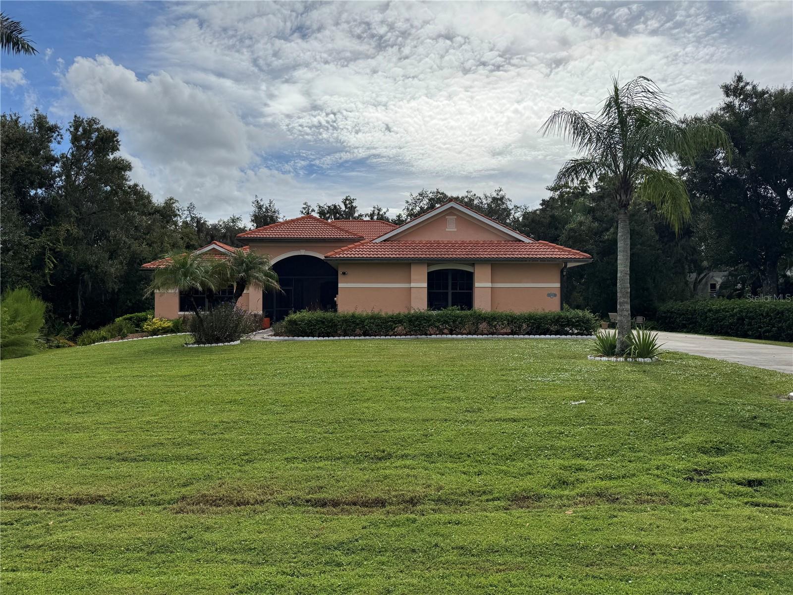Beautiful setting with almost 1 acre of property. This quite wooded Oakford property has just under 3000 sq ft and has 4 bedrooms and 3 full baths. Large screened pool area with built in heated spa to relax and listen to the sounds of nature. Large open great room floor plan with connected kitchen and dinning area allowing easy flow for relaxed entertainment. The kitchen is fully equipped with built in wall ovens, electric cooktop, dishwasher, refrigerator, microwave, all in stainless steel. Working in the kitchen you have views of the pool and the private back yard, also there is a breakfast area within the kitchen with a large aquarium window to enjoy the views. Primary suite is large with a large walk-in closet, the primary bath has a walk-in shower, soaking tub and duel vanities with lots of natural light. The 3 other bedrooms are set across the home with the other baths. There is a separate dinning area and an additional bonus room, which can can be set up as an home office or den. Outside you have beautiful oak trees and a large lawn to enjoy the nature. The pool and spa are heated and have a salt system for easy care. AC was new in 2023. Short drive into town to all the new restaurants and services available down Fruitville road, Oakford is just far enough out to enjoy all  the peace and quite of of country living.