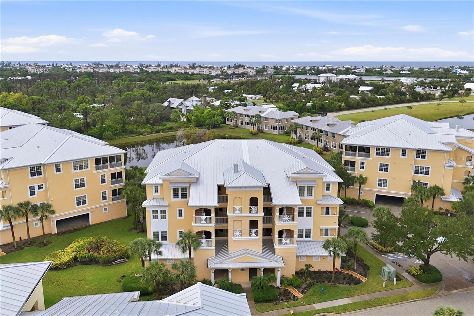 PENTHOUSE LIVING AT ITS FINEST IN THE HAMMOCKS! Discover the perfect blend of elegance, comfort, and coastal living in this beautifully updated 4-bedroom, 3-bath penthouse condominium located in the desirable gated community of The Hammocks in Englewood, Florida.

Step inside and immediately appreciate the abundance of natural light, spacious open-concept design, and beautifully coordinated finishes throughout. The expansive great room flows effortlessly into the inviting kitchen, creating an ideal setting for entertaining or simply enjoying everyday living.

Thoughtful updates have transformed this residence into an elegant coastal retreat. Gorgeous neutral tile flooring, installed diagonally throughout, creates a seamless, elegant appearance, complemented by freshly painted neutral interiors. Upscale plantation shutters adorn the windows, while updated lighting fixtures provide a cohesive designer touch. The beautifully appointed kitchen, previously remodeled and recently enhanced with a stylish backsplash and updated lighting, is ready for your next gathering. Generous storage throughout adds to the home's exceptional functionality.

With four bedrooms and three full bathrooms, there's plenty of room to spread out and welcome guests. One bedroom offers the perfect opportunity for a private office, den, or hobby room. An updated guest bathroom features a convenient walk-in bathtub with a door for added comfort.

THE LANAI IS TRULY A SHOWSTOPPER! Step outside onto your oversized screened lanai and enjoy breathtaking views of the tranquil pond and lush surroundings beyond. Imagine starting your mornings with coffee overlooking the water or ending your evenings relaxing in the peaceful Florida breeze. This is outdoor living at its finest!

Additional conveniences include elevator access, two parking spaces in the open garage beneath the building, and a private garage-level storage room.

ENJOY THE RESORT LIFESTYLE EVERY DAY! The Hammocks offers an impressive collection of amenities, including a beautifully updated clubhouse, resort-style swimming pool, tennis and pickleball courts, billiards room, and a well-equipped fitness center with additional equipment upgrades planned. Whether you're staying active, socializing with neighbors, or relaxing poolside, you'll love the lifestyle this community offers.

AND THE LOCATION? SIMPLY FANTASTIC! Nestled in beautiful Englewood, The Hammocks is conveniently located near Boca Grande, known for its pristine Gulf beaches, world-class fishing, boating, shelling, and charming coastal atmosphere. Enjoy nearby waterfront dining, shopping, and endless opportunities to embrace the Southwest Florida lifestyle.

Beautifully updated, generously sized, and surrounded by the beauty of paradise, this exceptional penthouse offers everything you've been looking for!

Your piece of Southwest Florida paradise awaits. Schedule your private showing today!