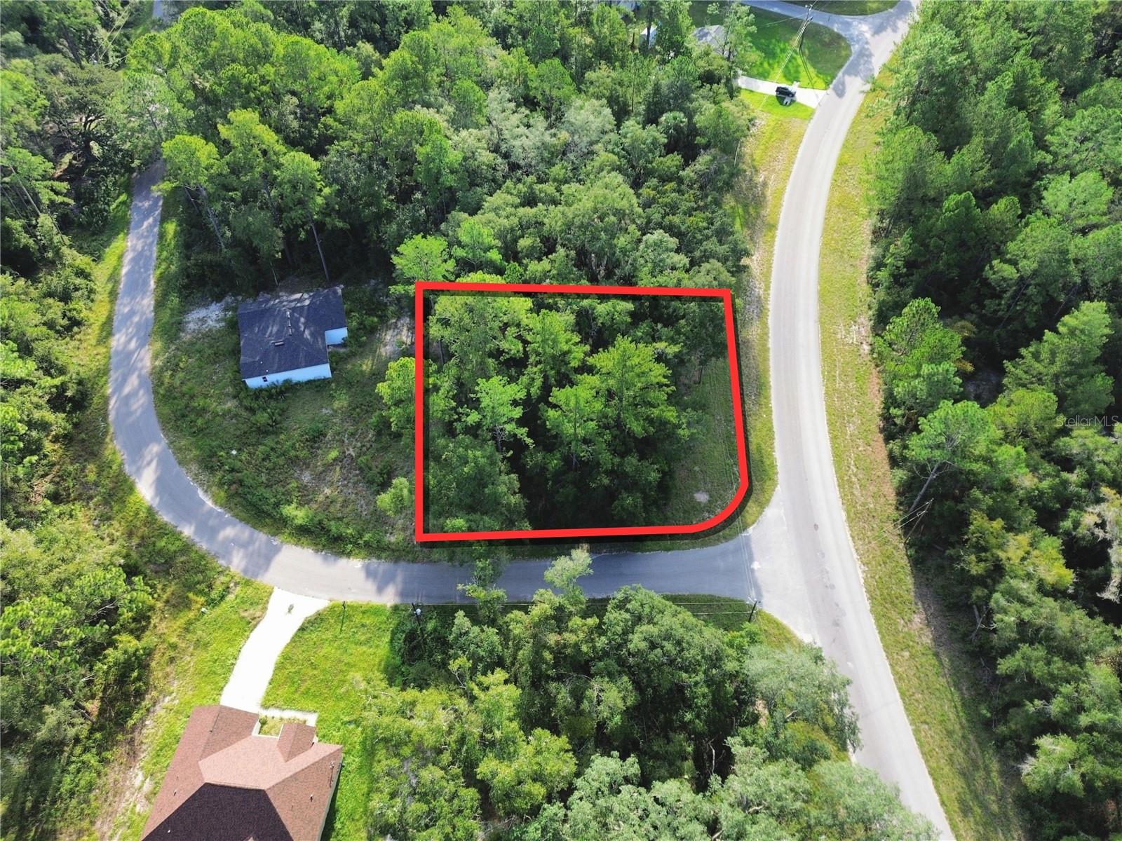 Excellent 0.27-acre corner lot with paved road access from Fisher Road and SE 100th Place, located in Silver Springs Shores Unit 44 just off SE Hwy 464C. No HOA. The lot measures approximately 100' x 118' and is zoned R-1 for single-family residential construction. The property is located in Flood Zone X, indicating minimal flood risk. Duke Energy is the area electric provider, with power lines located along the road frontage. A well and septic system will be required. Enjoy convenient access to nearby recreational areas, including Lake Weir, Lake Pendarvis, Lake Fay, and Blue Sink. Parcel ID: 9044-1578-13. For locating the property, you may use the neighboring address of 16400 SE 100th Place, Ocklawaha, FL 32179, or enter the following coordinates into Google Maps, Apple Maps, or Waze: 29.075799, -81.881358.