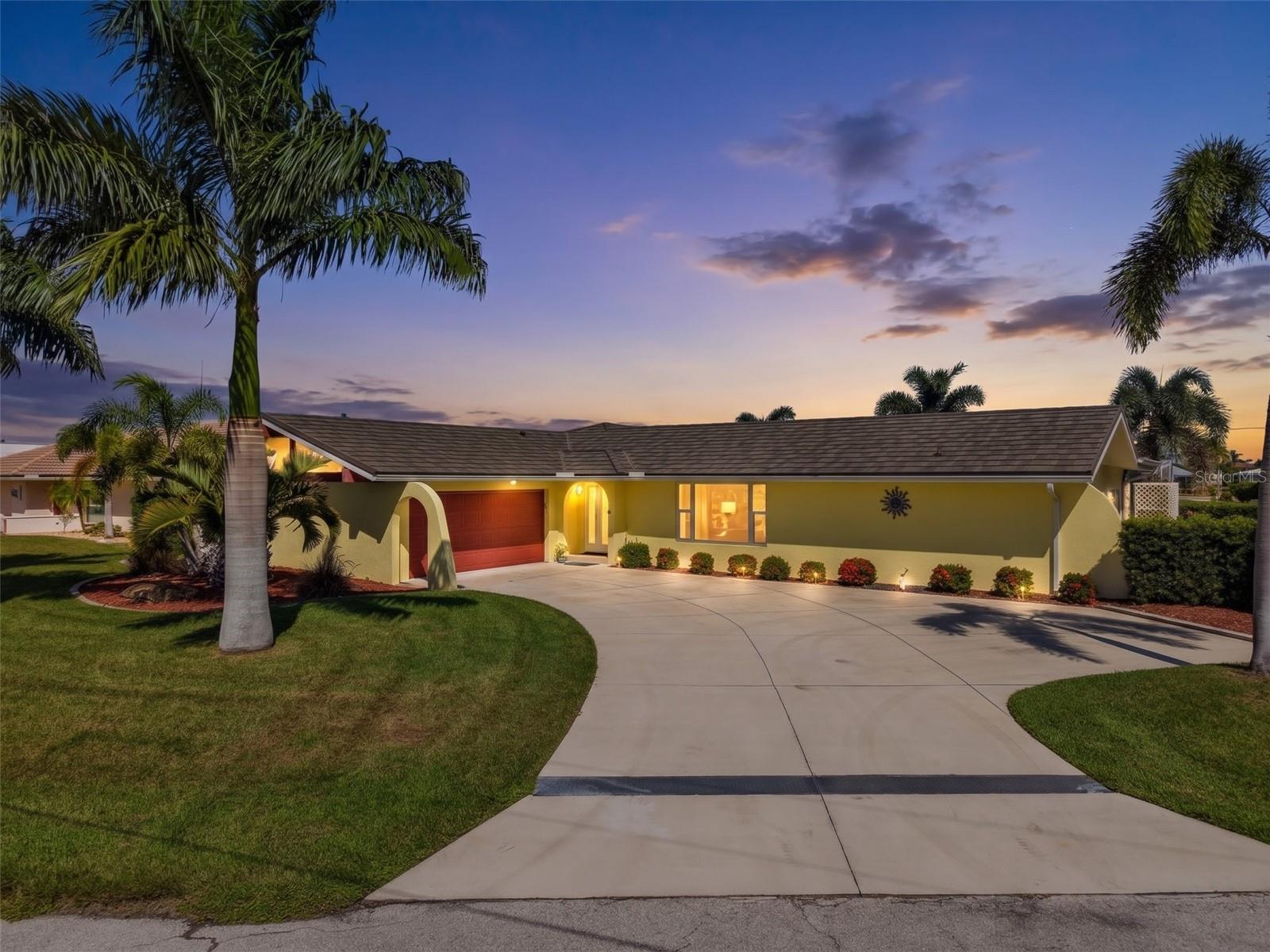 ASSUMABLE VA Loan with a 2.375% APR!!!   OVERSIZED GULF-ACCESS LOT WITH 103 FEET OF WATERFRONT set on a city-maintained concrete seawall, with a 30 foot concrete dock and 2 lifts, one is 10,000 lbs & one converted to hold 2 jet skis. QUICK ACCESS to Charlotte Harbor and then on to the Gulf of America! A true ENTERTAINERS DELIGHT with TONS OF UPGRADES!!!  Your new home has an OPEN FLOOR PLAN, upgraded soft-closed cabinetry & a HUGE KITCHEN ISLAND.  An INTERIOR RENOVATION was completed in 2025/2026 including NEW stove, microwave, cabinetry, granite, flooring, bathrooms, several hurricane impact windows & front door.  MECHANICAL UPDATES:  Air conditioner 2018, Metal Roof 2023, Heat Pump Water heater 2022, Electrical panels, WHOLE HOUSE REPIPE 2026.  The Property Appraiser shows the Year Conditioned as 1990 - 20 years younger than the year built! The home enjoys a split plan with 3 bedrooms, 2 baths and a GENEROUS SIZED 2 car SIDE ENTRY GARAGE with a hurricane overhead door.  HEATED POOL & free standing HOT TUB!!! New POOL HEAT PUMP 2020. Whole house HURRICANE PROTECTION with IMPACT windows & doors.   This BEAUTIFUL home is on a cul-de-sac with a much sought after eastern facing lanai, allowing you to enjoy your outdoor space all year long. Concrete driveway (2020) and WHOLE HOUSE WATER SOFTENER and RO system at the kitchen sink.   The outdoor secluded patio provides you with additional space to entertain & enjoy a BBQ or quiet reflection.  Punta Gorda is home to many festivals, a vibrant downtown area, world-class dining, entertainment & the Pickle Plex. Approximately 30 minutes away from several Gulf beaches and easy access to I-75, route 41. Make your exclusive showing today as this home is sure to please! Virtual tour attached.