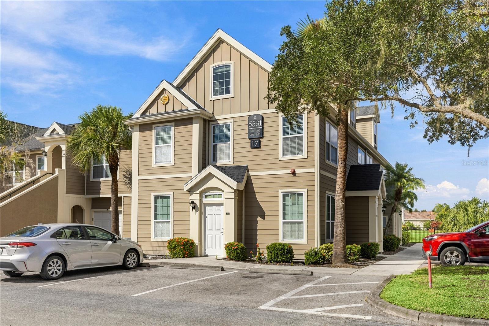 Virtually Staged. Welcome to Admirals Walk, a gated townhome community in Sarasota where this end unit has been completely redone and is ready for its next owner. It offers 2 bedrooms, 2 bathrooms, a third-level loft and 1,316 square feet. Every space has been updated with today’s buyer in mind, so you can move in and start enjoying it from day one. From the private ground-level entry, refinished stairs lead to a bright, open main level with vaulted ceilings, clerestory windows, new laminate flooring and sleek black track lighting. The new kitchen anchors the space, with crisp cabinetry, quartz countertops and a fluted peninsula with breakfast bar seating. It also has a new microwave and a reverse-osmosis filtered water tap. Just off the dining area, a built-in dry bar with a wine fridge makes hosting easy. The two bedrooms sit on opposite sides of the home for privacy, and each has its own en-suite bath and walk-in closet. That makes the layout ideal for co-owners, visiting family or a dedicated guest suite. The primary bath has been refreshed with new marble-look shower tile. The third level adds a versatile loft that is perfect as a dedicated home office or an additional guest space, set apart from the main living area. New light fixtures, ceiling fans, mirrors and AC vents run throughout, along with a 2026 water heater, 2020 AC system, and with the washer and dryer included in the sale! Admirals Walk residents enjoy a clubhouse, community pool and fitness center in a pet-friendly setting. Clark Road shopping and dining are minutes away, with easy access to I-75, downtown Sarasota and Siesta Key Beach. **THIS PROPERTY QUALIFIES FOR A 1% LENDER INCENTIVE IF USING PREFERRED LENDER. INQUIRE FOR MORE DETAILS.**