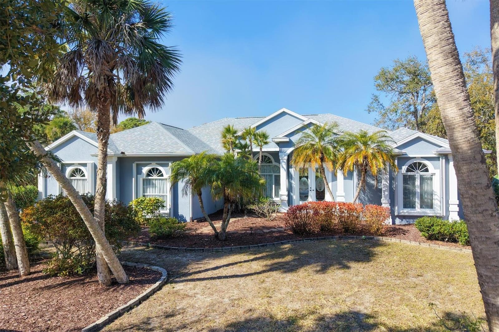 Discover the perfect blend of expansive space, total privacy, and luxury at 750 Harmony Lane. Nestled on a rare 0.63-acre oversized lot within the sought-after Artist Acres neighborhood, this property is located in the historic "Olde Englewood" district. The prime location places you less than a mile to Lemon Bay Park and Dearborn Street and less than a mile to the local culture, while remaining less than 5 miles to Englewood Beach & Manasota Key! Offering over 3,089 square feet of meticulously maintained living space, this masonry-constructed home provides the ultimate worry-free lifestyle thanks to an impressive list of recent high-value upgrades, including a total ROOF REPLACEMENT IN 2024, a NEW 5-TON HVAC SYSTEM (2021) with multi-zone controls, and NEW WATER HEATERS (2024 & 2025).
The interior is a showcase of design and comfort, featuring 9-foot doors throughout, elegant tray ceilings, and fresh interior paint (2025) that enhances the bright, airy atmosphere, all greeted by a quality circular driveway that immediately establishes strong curb appeal. The home is designed for both connection and relaxation with a versatile 3/4-bedroom, 3-bathroom floor plan that flows effortlessly. The heart of the residence is the stunning chef's kitchen, recently elevated with sleek new QUARTZ COUNTERTOPS (2025) and an abundance of cabinetry. A large center island provides casual prep space and overlooks the main living areas, while an adjacent dining nook features an aquarium window offering unobstructed panoramic views of the pool and lanai. The master suite serves as a true sanctuary, complemented by an expansive en-suite bath with dual vanities, roman style garden tub and walk in shower. The true split floor plan with the additional bedrooms, office and large guest baths offer plenty of room for family or visitors with the office area featuring a separate private entrance to the outside and the pool area.
Step through the pocket sliding doors to discover an outdoor oasis designed for entertaining or quiet afternoons. The expansive lanai provides distinct zones for alfresco dining and lounging, protected by a RE-SCREENED POOL CAGE IN 2022 alongside a POOL DECK that was professionally repainted in 2025 for a resort-style feel. A convenient outdoor shower allows you to easily rinse off the salt and sand after a day at the nearby beaches. Hobbyists and car enthusiasts will appreciate the oversized 3-car garage complete with a dedicated workshop area. Because there are NO DEED RESTRICTIONS or HOA fees, you have complete flexibility to bring your boat, RV, and outdoor gear, perfectly supporting an active coastal lifestyle. Surrounded by massive mature landscaping that makes the backyard feel like a private park, this property combines absolute convenience with tranquil living in one of Englewood's most desirable communities. Schedule your exclusive showing today and start living your BEST Florida Life!