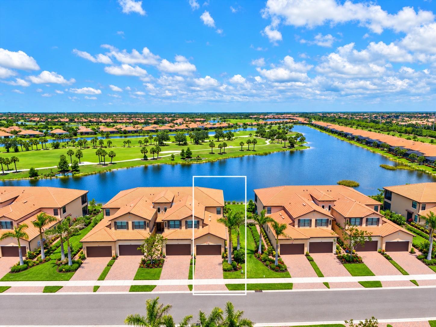 **BETTER THAN NEW AND AVAILABLE FOR IMMEDIATE OCCUPANCY!** Fresh interior paint, professionally steam-cleaned tile floors and grout, and newly sealed grout make this stunning first-floor end-unit condo truly move-in ready! Located in the highly desirable guard-gated community of Sarasota National, this beautifully upgraded residence offers breathtaking golf course and water views overlooking the 4th hole. Enjoy the peaceful surroundings from your oversized screened lanai, with gorgeous views from nearly every room.

Designed to live like a single-family home, this spacious residence features 3 bedrooms, 2 full bathrooms, a private screened side entry, and a 2-car garage complete with epoxy flooring and a mini-split AC system. Natural light fills the open floor plan, complemented by diagonal tile flooring, crown molding, a decorative leaded-glass front door, and HURRICANE IMPACT-RATED WINDOWS AND SLIDING GLASS DOORS THROUGHOUT! **LOCATED IN FLOOD ZONE X!**

The beautifully appointed kitchen features white shaker cabinetry, quartz countertops, stainless steel appliances, and a large center island, perfect for entertaining or everyday living. The spacious primary suite offers direct lanai access, room for a sitting area or home office, two walk-in closets, and a luxurious bathroom with dual vanities, an oversized walk-in shower with seamless glass, and a private water closet. Two additional bedrooms and a full guest bathroom are positioned on the opposite side of the home, with a pocket door allowing the entire guest wing to be closed off for additional privacy. A separate interior laundry room adds convenience.

Lovingly maintained by the original owners, this condo offers low-maintenance living, with exterior maintenance, landscaping, pest control, cable TV, water, sewer, and trash service included in the association fees.

Located within the Tarflower II association, this residence also offers the opportunity to enjoy Sarasota National's newly redesigned championship golf course. Currently undergoing a major renovation led by renowned golf course architects Fry/Straka, the course is expected to reopen in the coming months, bringing an enhanced golfing experience to this exceptional community. Best of all, TWO GOLF MEMBERSHIPS ARE INCLUDED with no additional initiation or buy-in fees!

Sarasota National offers an exceptional resort-style lifestyle within a 2,400-acre Audubon-certified sanctuary surrounded by lakes, preserves, and natural Florida scenery. Residents enjoy a spectacular 30,000-square-foot clubhouse, resort-style swimming pool, hot tub, outdoor tiki bar serving food and drinks, coffee house, fine dining restaurant, 7,000-square-foot fitness center with classes, tennis, pickleball, bocce ball, dog park, playground, event lawn, and an 18-hole championship golf course.

Ideally located just minutes from CoolToday Park, the Atlanta Braves' spring training facility, and the growing Wellen Park Town Center, with convenient access to Gulf Coast beaches, shopping, dining, and historic downtown Venice.

Whether you're looking for a full-time residence or a seasonal Florida retreat, this exceptional condo offers the space, upgrades, views, and lifestyle you've been searching for. **NO NEED TO WAIT, IMMEDIATE OCCUPANCY AVAILABLE! MOVE RIGHT IN** and start enjoying everything Sarasota National has to offer!
