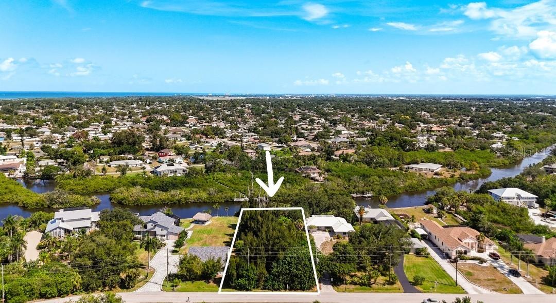 What would it feel like to build your Florida home in a quiet natural setting, then enjoy your own separate piece of Alligator Creek waterfront?
This South Venice offering includes TWO SEPARATE PARCELS sold together totaling approximately 0.48 acres/21,068 sq ft: an approximately 0.18-acre homesite along Lemon Bay Drive and a separate approximately 0.30-acre riparian parcel with roughly 80 feet of Alligator Creek frontage.
For the buyer who would rather preserve capital than commit the entire purchase price at closing, the seller is willing to consider seller financing with substantial down payment terms and a term of up to 5 years, subject to seller approval and mutually acceptable final terms.
Imagine a custom Florida home designed around the way you want to live: quiet mornings outside, evenings near the water, a kayak ready for a paddle, a fishing rod close by, or simply a place to enjoy the creek. Subject to permitting and site conditions, a dock or pier may provide access for kayaking, fishing or a suitable boat. NO MANDATORY HOA.
Alligator Creek continues west toward the Intracoastal Waterway and Lemon Bay within an established waterfront corridor where properties along Lemon Bay Drive include docks, fishing piers and kayak access. Water depth, tides, bridge clearance, navigability and vessel suitability should be independently verified.
Lot 37, Parcel 0456-09-0044, is approximately 0.18 acre, a legal lot of record with RSF-3 zoning and MODR Future Land Use previously verified with Sarasota County. Separate riparian Parcel 0456-09-0040 is approximately 0.30 acre with approximately 80 feet of Alligator Creek frontage. MLS-reported dimensions are approximately 263.35' x 80'. Dock or pier feasibility is subject to permitting and agency approval.
South Venice offers optional amenities without mandatory HOA dues, including the South Venice Beach Ferry, Boat Ramp and Kayak/Canoe/Paddleboard Launch. Current published 2026 pricing is approximately $200/year for the ferry, $150/year for Boat Ramp access and $100/year for the paddle launch. Pricing, eligibility, rules, schedules and amenities may change; buyers should verify current information.
Approximate drive times: South Venice Beach Ferry 3-5 minutes, Manasota Beach 5-8 minutes, Historic Downtown Venice 8-10 minutes, Venice Beach and Caspersen Beach 10-12 minutes. Nearby Shamrock Park offers paved trails with connections to Venetian Waterway Park and the Legacy Trail network. Drive times are estimates.
Electric is available at the street. Central water and sewer are not available at the homesite; well and septic are anticipated. Flood conditions include AE and Floodway designations.
IMPORTANT: The homesite and Alligator Creek parcel are separate parcels, not one continuous waterfront homesite. Buyer and buyer's agent should independently verify parcel configuration, boundaries, acreage, zoning, buildability, utilities, well/septic, flood and environmental conditions, water depth/navigability, bridge clearance, dock/pier feasibility and permitting, amenity access and fees, measurements, drive times and intended use with applicable authorities.