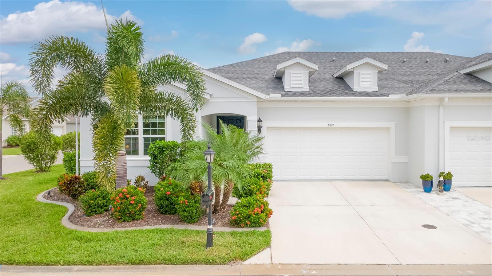 Why Wait for New Construction? Your Like-New Neal-Built Villa Awaits in Kingsgate! Welcome to this beautifully appointed, 2023 Neal-built villa in Kingsgate, a desirable 55+ golf course community in Port Charlotte, Florida! Offering approximately 1,500 square feet of thoughtfully designed living space, this light and airy home combines modern style, quality upgrades, and relaxed Florida living. Featuring 2 spacious bedrooms plus a den, an open-concept floor plan, and the added convenience of being sold furnished, this home is ready for you to move right in and start enjoying the Florida lifestyle! The inviting interior showcases tile flooring throughout and elegant stone countertops throughout the home, creating a cohesive, upscale feel. The open living, dining, and kitchen areas flow seamlessly together, providing the perfect setting for entertaining friends and family or simply enjoying everyday life. The spacious primary suite offers a walk-in closet and a private en-suite bathroom complete with dual sinks and a walk-in shower. A generously sized second bedroom and versatile den provide plenty of room for guests, hobbies, a home office, or additional living space. Step outside and discover even more to love! Enjoy your morning coffee or unwind in the evening on the additional patio space overlooking the peaceful lake, where you can take in the tranquil water views and beautiful Florida surroundings. The thoughtfully enhanced landscaping features additional palm trees, a lush Floratam lawn, landscape lighting, and an irrigation system to help keep everything looking its best. Impact-resistant windows provide added peace of mind, while the garage features a durable epoxy-coated floor for a clean, finished look. Why go through the time, expense, and hassle of building when you can own this like-new, move-in-ready Neal villa with upgrades already in place? From the attractive finishes and enhanced outdoor living space to the beautiful lake views and furnished interior, this home offers the benefits of newer construction without the wait. Located in the sought-after Kingsgate 55+ golf community, you can enjoy a relaxed lifestyle with golf, recreation, and the best of Southwest Florida living right at your fingertips. Situated in flood zone X.