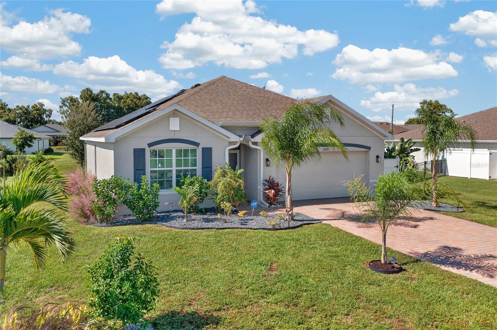 Welcome to 25157 Alcazar Drive, a beautifully maintained 4-BEDROOM, 2-BATHROOM, 2-CAR GARAGE HOME with FURNISHINGS AVAILABLE, offering 1,828 square feet of thoughtfully designed living space in the desirable BURNT STORE VILLAGE community of Punta Gorda! Combining modern comfort, stylish finishes, and valuable upgrades, this inviting residence is the perfect place to enjoy the Southwest Florida lifestyle.

From the moment you arrive, UPGRADED LANDSCAPING enhances the home's curb appeal, creating a warm and welcoming first impression. Step inside to discover a bright, spacious interior featuring a versatile OPEN-CONCEPT FLOOR PLAN, neutral finishes, and beautiful TILE FLOORING THROUGHOUT THE MAIN LIVING AREAS, with comfortable carpeting in the bedrooms. The thoughtfully designed layout creates an effortless flow between the living room, dining area, and kitchen, making everyday living and entertaining a breeze.

At the heart of the home, the kitchen offers a welcoming space to cook, gather, and entertain. Featuring an UPGRADED KITCHEN SINK, ample cabinetry, and a pantry complete with CUSTOM BUILT-IN STORAGE, this functional space makes organization effortless. The adjoining dining and living areas provide plenty of room to relax, entertain guests, or simply enjoy time at home.

Retreat to the spacious PRIMARY SUITE, where comfort and functionality come together beautifully. The bedroom offers a peaceful escape, complemented by an impressive 8.5' X 7.5' WALK-IN CLOSET with built-in organization. The private en-suite bathroom features DUAL SINKS and a generously sized WALK-IN SHOWER, creating a comfortable space to begin and end each day. Three additional bedrooms offer flexibility for family, visiting guests, a home office, or hobbies, while a well-appointed second bathroom provides added convenience.

Beyond its inviting interior, this home is equipped with valuable upgrades designed for comfort and peace of mind, including IMPACT-RESISTANT WINDOWS and SOLAR PANELS THAT WILL BE PAID OFF AT CLOSING! Additional built-in closet organization throughout the home maximizes storage and everyday functionality. Best of all, FURNISHINGS ARE AVAILABLE, providing an exceptional opportunity for a seamless, move-in-ready transition into your new Florida home.

Nestled within BURNT STORE VILLAGE, residents enjoy a peaceful residential setting with beautiful GREENBELTS woven throughout the community, offering open green space, natural views, and a relaxing sense of room to breathe, all while remaining conveniently located near shopping, dining, boating, golf courses, and the beautiful waterfront destinations of Punta Gorda and Cape Coral. Whether you're searching for a full-time residence, seasonal retreat, or a comfortable place to embrace the Florida lifestyle, this home offers an outstanding combination of space, convenience, and thoughtful upgrades.

MOVE-IN READY, FURNISHINGS AVAILABLE, AND LOADED WITH VALUABLE FEATURES — YOUR SOUTHWEST FLORIDA LIFESTYLE STARTS HERE!