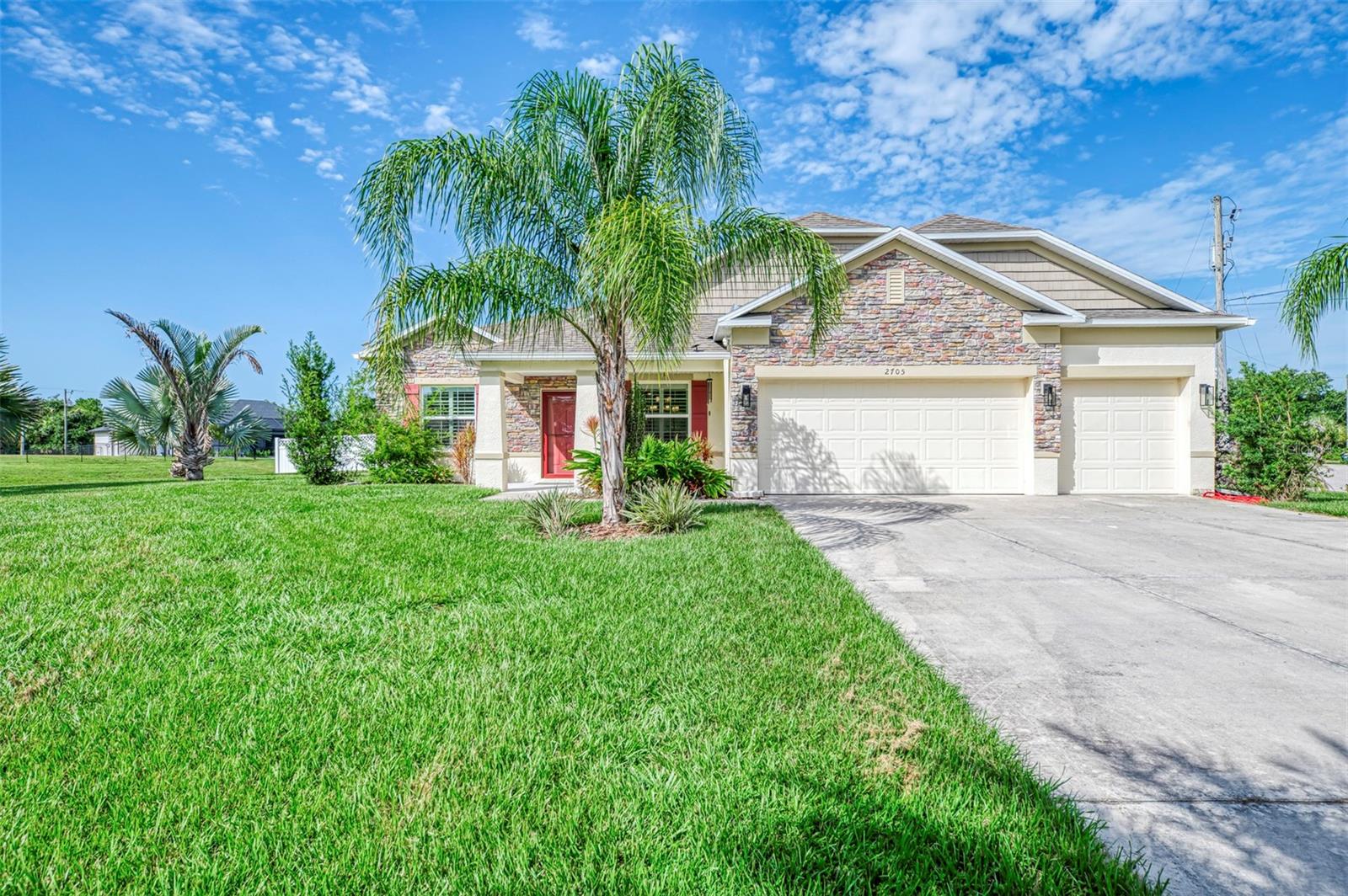 UPGRADES BEYOND COMPARE: This exceptional 2020-built POOL/SPA home offers an incredible level of quality, luxury, and thoughtful upgrades rarely found in today's market. Featuring 2,431 sq. ft., 4 bedrooms, 3 full baths, a 3-car garage, and an 11' x 14' office/den (or flex room), this impressive home sits on over half an acre (23,304 sq. ft.) with two oversized lots, a fully fenced corner homesite, lush professional landscaping, and plenty of room to park your boat, RV, and all your toys. The backyard is truly a private resort! Enjoy the spectacular custom multi-level heated saltwater pool and spa showcasing a 30' x 60' Travertine stone deck, elegant glass tile accents, PebbleTec finish, sun shelf with bubbler, four water spouts, two cascading waterfalls, multi-color LED lighting, and both solar and electric pool heating for year-round enjoyment. The Travertine decking has even been extended beyond the screened lanai to create the perfect outdoor grilling and entertaining area. Built with quality and longevity in mind, the seller invested in UPGRADES you'll appreciate for years to come, including a whole-house water filtration system, premium white vinyl privacy fencing installed 3 inches into the ground to help prevent unwanted critters, termite-treated interior concrete walls (10-year protection), and ceramic plank tile flooring throughout the main living areas and bathrooms with a protective polymer coating applied before installation to help prevent cracking. Step inside and you'll immediately notice the spacious open floor plan featuring soaring 9'4" ceilings, elegant crown molding, abundant natural light, and breathtaking pool and spa views from nearly every main living area. The gourmet kitchen is designed to impress with granite countertops, a large center island, glass tile backsplash, upgraded stainless steel appliances including a Wi-Fi Smart double oven, Smart glass cooktop range, Smart microwave, stylish pendant lighting, and an open layout overlooking the expansive great room and outdoor living space. Hosting family and friends is effortless in the oversized formal dining room with beautiful tray ceilings and seating for 14+ guests. Plantation shutters throughout the home add timeless elegance, while the spacious indoor laundry room includes a Samsung washer and dryer. The luxurious owner's suite offers tray ceilings with crown molding,  and a spa-inspired bath featuring dual granite vanities, wood cabinetry, a walk-in glass shower, a relaxing soaking tub with a second shower, and generous walk-in closet space. The guest bedrooms are exceptionally spacious, with the second bedroom offering two large closets, while bedrooms three and four feature oversized double closets. Both guest bathrooms are beautifully finished with granite countertops, wood cabinetry, and upgraded tile surrounds. This move-in ready home offers far more upgrades than can be listed and represents exceptional value compared to new construction. Located in one of North Port's most desirable neighborhoods, you'll enjoy convenient access to shopping, schools, the new Sarasota Memorial Hospital, Cool Today Park (Atlanta Braves Spring Training), Town Center, restaurants, and quick access to I-75 for an easy commute. Why wait to build when you can own a home loaded with premium upgrades that would cost tens of thousands more to duplicate today? Schedule your private showing today before this extraordinary home is gone!