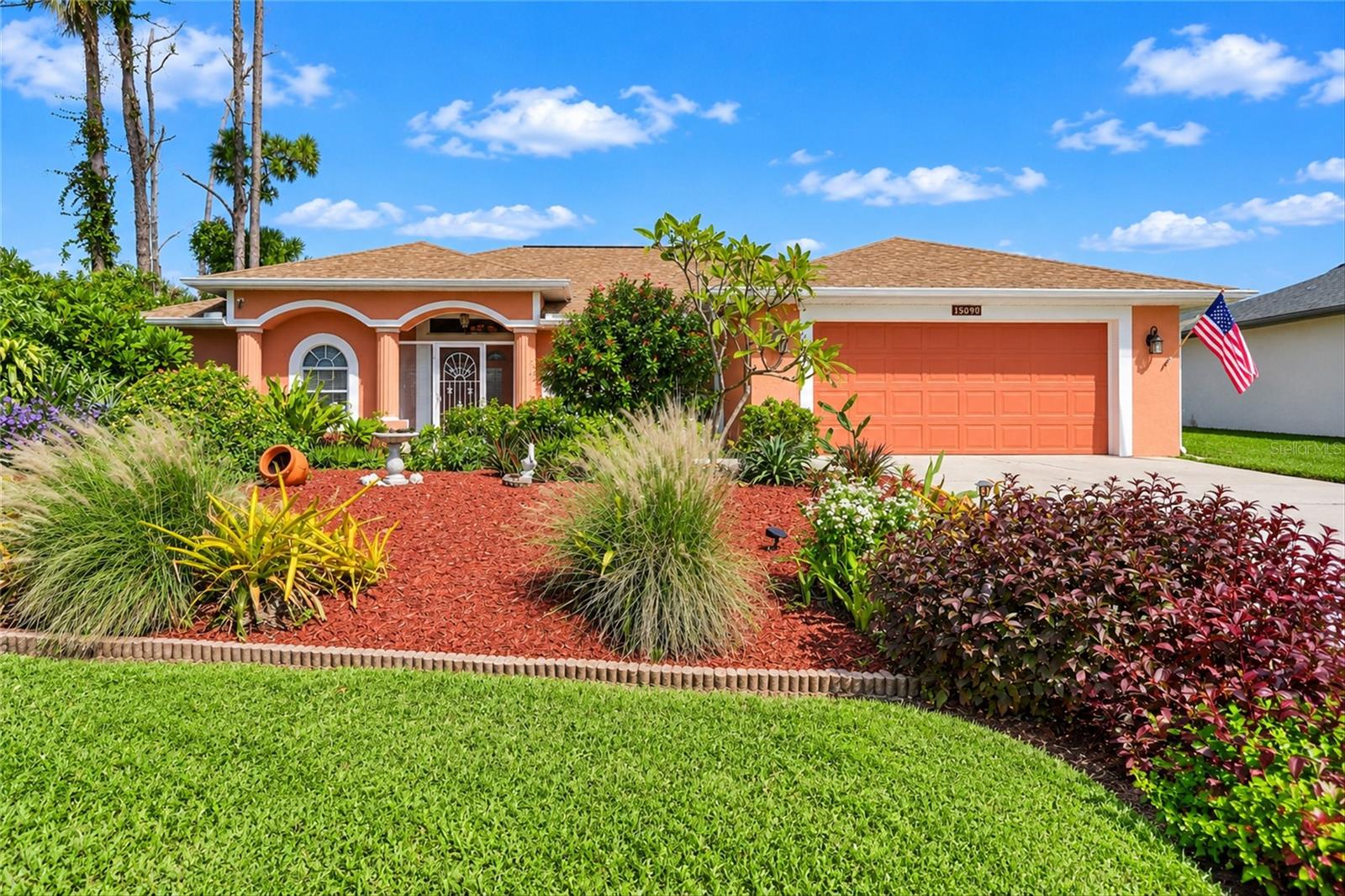 Virtually Staged. SPACIOUS 3-BEDROOM, 2-BATHROOM HOME WITH A 2-CAR GARAGE, EXPANSIVE SCREENED LANAI, AND FULLY FENCED BACKYARD! NOT IN FLOOD ZONE.  Discover comfortable Florida living in this beautifully maintained Port Charlotte home featuring a desirable SPLIT-BEDROOM FLOOR PLAN, soaring vaulted ceilings, and spacious living areas filled with natural light. Attractive curb appeal welcomes you with a CORAL-COLORED EXTERIOR, lush tropical landscaping, mature trees, and a WIDE CONCRETE DRIVEWAY leading to the oversized garage. A SCREENED FRONT ENTRY adds to the home's inviting appeal. Step inside through DOUBLE ENTRY DOORS to a welcoming foyer that opens to the IMPRESSIVE GREAT ROOM featuring VAULTED CEILINGS, decorative architectural ledges, elegant archway accents, and TILE FLOORING THROUGHOUT THE MAIN LIVING AREAS. The spacious living room provides plenty of room for gathering and entertaining, while OVERSIZED SLIDING GLASS DOORS open to the screened lanai. The adjoining DINING ROOM offers an elegant setting for special occasions, highlighted by a decorative chandelier and THREE ARCHED WINDOWS that add architectural character. The OPEN KITCHEN features SOLID SURFACE COUNTERTOPS, abundant cabinetry, a decorative tile backsplash, STAINLESS STEEL APPLIANCES, and a CLOSET PANTRY. An expansive WRAPAROUND BREAKFAST COUNTER with a DOUBLE-BASIN SINK provides additional seating and preparation space, complemented by recessed lighting and distinctive ceiling details. The adjacent DINETTE features a decorative chandelier, an AQUARIUM-STYLE WINDOW overlooking backyard and sliding glass doors leading to the outdoor patio. The GENEROUSLY SIZED PRIMARY SUITE offers a comfortable private retreat with plush carpeting, an attractive ARCHED WINDOW, direct lanai access, and TWO WALK-IN CLOSETS. The spacious ENSUITE BATHROOM features a LONG DUAL-SINK VANITY with abundant cabinetry, a large wall-to-wall mirror, decorative lighting, and an OVERSIZED TILED WALK-IN SHOWER accented by distinctive GLASS-BLOCK WALLS. Positioned on the opposite side of the home for privacy, TWO GUEST BEDROOMS feature built-in closets and share a conveniently located full bathroom. ONE GUEST BEDROOM ALSO OFFERS SLIDING GLASS DOORS TO THE PATIO AREA. An INTERIOR LAUNDRY ROOM provides added convenience with access to the garage. Outdoor living takes center stage on the impressive 37-FOOT-LONG SCREENED LANAI, offering generous space for dining, lounging, and entertaining while enjoying the peaceful surroundings. The FULLY FENCED BACKYARD features an open lawn bordered by mature trees, tropical plants, and landscaped garden beds that create a private, natural setting. A PAVER PATIO provides additional space for grilling and outdoor gatherings, while a STORAGE SHED offers convenient room for tools, lawn equipment, and recreational items.
Additional highlights include a WHOLE-HOUSE CENTRAL VACUUM SYSTEM, KEVLAR STORM SHUTTERS, and numerous important updates, including a NEW ROOF (2022), A/C SYSTEM (2022), WATER HEATER (2022), WASHER AND DRYER (2024), and REFRIGERATOR, DISHWASHER, AND MICROWAVE (2024). With NO HOA FEES and a convenient location near US-41, shopping, dining, schools, medical facilities, and everyday amenities, this inviting property offers an excellent combination of comfort, functionality, and Florida lifestyle appeal. Schedule your private showing today!