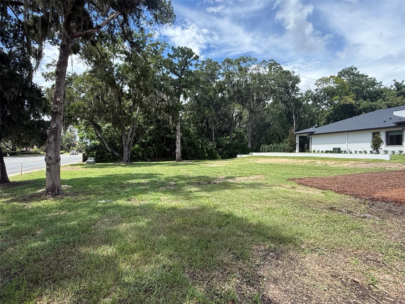 Build your dream home in the desirable Woodfields area of Ocala. This cleared homesite is within Ocala's city-approved golf cart area. Drive your golf cart on city streets to the downtown farmer's market, Eighth Street Elementary or Osceola Middle. This lot features mature trees and is next door to the new AR Homes by Arthur Rutenberg model home. This ultra-convenient property has mature trees, no HOA, and offers quick access to grocery stores, hospitals and restaurants. Must use AR Homes as builder.