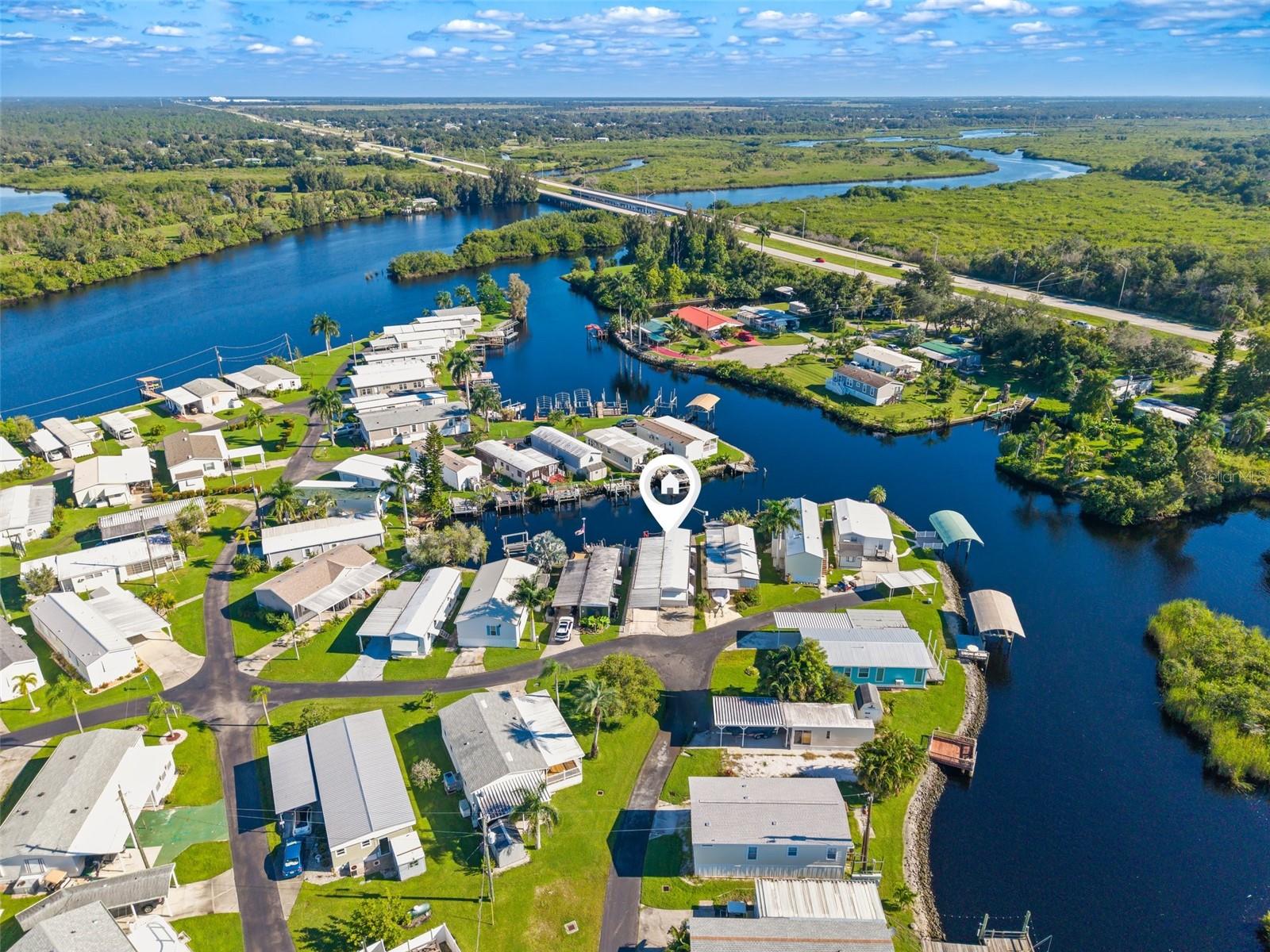 Furnished Waterfront Home with Private Dock in Lazy Lagoon – Punta Gorda, FL! Welcome to your next waterfront adventure! This furnished, move-in-ready 2-bedroom, 2-bath home with a private dock and electricity is nestled in the highly desirable 55+ Lazy Lagoon community. Enjoy the charm of waterfront living, a spacious layout, and a wealth of community amenities in one inviting package. With so much to offer, this home makes it easy to settle in and start enjoying the Florida lifestyle! Step inside and discover an open floor plan that feels bright, roomy, and welcoming. The living room features a ceiling fan, while the kitchen brings style and function together with white raised-panel cabinets, granite countertops, and a stove. Need extra space to relax or entertain? The huge family room offers plenty of room to spread out and enjoy your favorite activities. Both bedrooms are spacious, giving you comfort and flexibility. The home features two full bathrooms with their own special touches. One includes dual sinks, a tub and shower combination, and glass doors. The second features a Roman shower for a fresh, classic look. You’ll also appreciate the convenience of an inside laundry room. Luxury vinyl flooring runs throughout the entire home, adding a clean, modern look with easy-care appeal. Outside, marble chip rock surrounds the home for a neat, finished appearance. And with your own private dock equipped with electricity, you can enjoy easy access to the waterfront right from home! Enjoy the Lazy Lagoon Waterfront Lifestyle! Lazy Lagoon is more than just a neighborhood—it’s a vibrant waterfront community packed with ways to relax, play, and connect. The community features private roads, extra guest parking, and an exclusive boat ramp for easy access to Shell Creek. Love to fish? A convenient fish cleaning station makes it easy to handle your catch. The impressive 2,000-square-foot clubhouse, complete with a commercial kitchen, serves as the hub for community events and gatherings throughout the year. Stay active with shuffleboard courts, enjoy a friendly game of billiards, or spend time in the pool room. Boating fans will also appreciate more than 2,000 feet of maintained community shoreline. Need a place to keep your boat or trailer? A private, secured storage compound is available for a small annual fee. A Convenient Punta Gorda Location. When it’s time to explore, you’re just minutes from Punta Gorda’s excellent dining, shopping, waterfront parks, and entertainment. Enjoy the perfect mix of peaceful waterfront surroundings and convenient access to local favorites. Don’t miss this opportunity to enjoy waterfront living in Lazy Lagoon, a well-maintained, amenity-rich 55+ community. With its furnished, move-in-ready interior, private dock with electricity, spacious rooms, and outstanding community features, this home is ready for its next chapter. Schedule your private tour today and discover all that this special waterfront home and Lazy Lagoon have to offer!