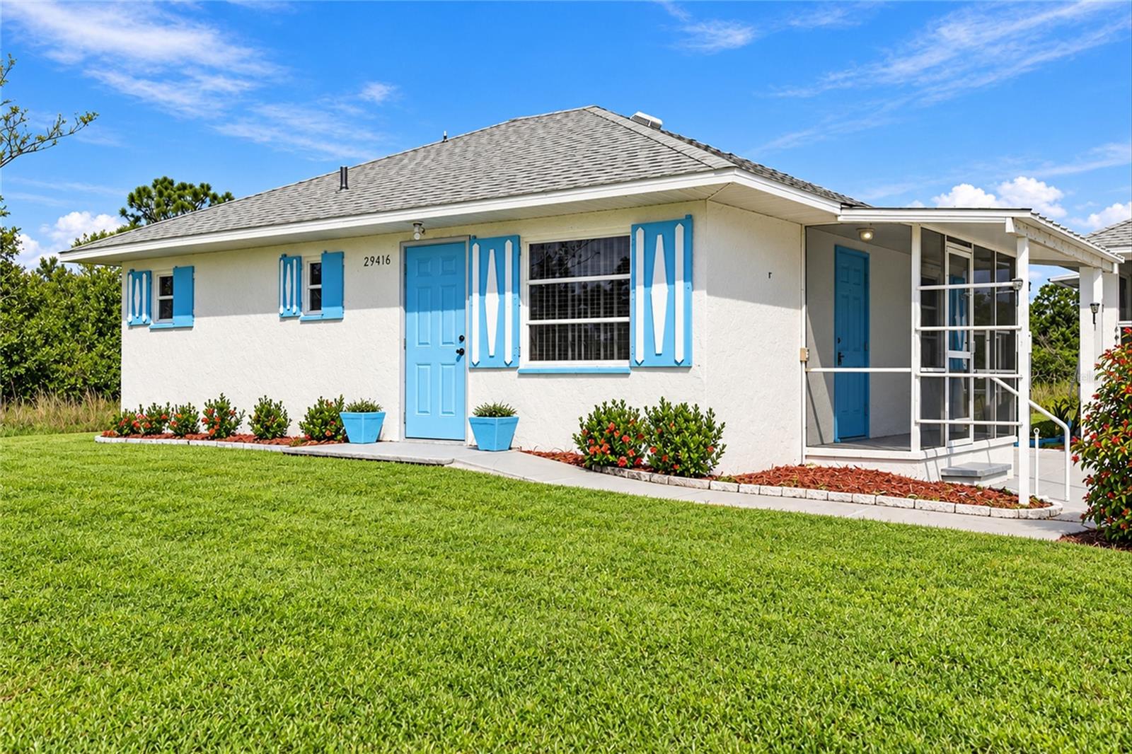 WELCOME TO PEACE RIVER SHORES IN PUNTA GORDA! Discover peaceful Florida living with this charming 2-BEDROOM, 1-BATHROOM HOME FEATURING A DETACHED GARAGE/OUTBUILDING WITH AN UPSTAIRS BONUS ROOM! Situated on a spacious property surrounded by natural greenery, this unique residence offers privacy, versatility, and plenty of outdoor space. NO HOA OR CDD FEES AND LOCATED IN FLOOD ZONE X! Attractive curb appeal includes a light-colored exterior accented by cheerful blue doors and shutters, a NEW ROOF IN 2023 and a welcoming covered side entry. A long concrete driveway provides ample parking and extends to the detached building. Step inside to a BRIGHT AND SPACIOUS LIVING ROOM featuring attractive wood laminate flooring, a ceiling fan, and abundant natural light. A decorative half-wall creates a comfortable transition into the GENEROUSLY SIZED EAT-IN KITCHEN, complete with tile flooring, white cabinetry with contrasting dark hardware, ample counter space, a decorative tile backsplash, and white appliances, including a range and refrigerator. A double-basin stainless steel sink overlooks the outdoors, while the adjoining dining area offers plenty of room for everyday meals and gatherings. The SPACIOUS PRIMARY BEDROOM features wood laminate flooring, a ceiling fan, and two windows providing natural light. Two separate closet areas, including a generously sized walk-in closet with built-in shelving, offer excellent storage. The full bathroom includes tile flooring, a tub/shower combination with a grab bar, and a single-sink vanity with cabinet storage. A dedicated interior laundry room adds convenience, with tile flooring throughout the remainder of the home. A highlight of this property is the DETACHED GARAGE/OUTBUILDING WITH AN UPSTAIRS BONUS ROOM AND EXPANSIVE SCREENED AREA! The impressive 24'2" x 30'5" SCREENED AREA features a concrete floor and ceiling fans, creating an inviting space for entertaining, relaxing, or enjoying the Florida breeze. This versatile area also offers POTENTIAL FOR CONVERSION INTO ENCLOSED STORAGE FOR VEHICLES, LAWN EQUIPMENT, RECREATIONAL TOYS, OR A WORKSHOP. Upstairs, the 10'5" x 13'6" BONUS ROOM features a countertop with a sink, built-in shelving, and storage, making it an ideal space for hobbies, crafts, or a private retreat. An additional outdoor patio and generous concrete parking area further enhance the property's functionality. The expansive grounds provide plenty of room for gardening, outdoor activities, or simply enjoying the peaceful surroundings. Located in PEACE RIVER SHORES, this property offers a relaxed residential setting with convenient access to historic downtown Punta Gorda, waterfront dining, shopping, parks, boating, fishing, and the beautiful Peace River. DON'T MISS THIS UNIQUE OPPORTUNITY TO ENJOY THE FLORIDA LIFESTYLE WITH A VERSATILE DETACHED OUTBUILDING, GENEROUS OUTDOOR SPACE, AND ROOM TO MAKE IT YOUR OWN!