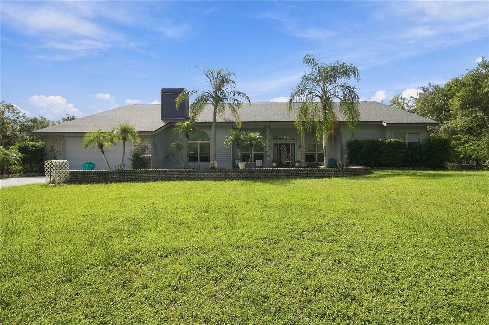 Discover space, privacy, and serene living in Sarasota's coveted Oak Ford community. Nestled on 5 sprawling, tree-lined acres off Fruitville Road, this 3-bedroom, 2.5-bath home is a tranquil retreat surrounded by nature. Step into a private, wooded backyard oasis featuring a massive 9-foot-deep pool and attached spa—perfect for relaxing or entertaining under the open sky. Inside, three charming fireplaces bring warmth and character to the living spaces. Known for its quiet, country-style atmosphere and unlit streets that preserve the clear night sky, Oak Ford offers an unmatched sense of peaceful seclusion. If you crave room to roam without sacrificing convenience, this distinctive estate is a must-see.