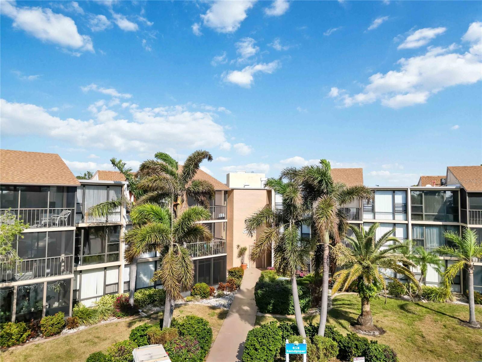 This is the one * END UNIT is a GREAT LOCATION * MUCH SOUGHT AFTER BUT RARELY AVAILABLE Garden View Condo in the RESORT STYLE COMMUNITY OF BIRD BAY * The GARDEN VIEWS are BEAUTIFUL! * Just steps to the amazing Pool & Clubhouse with Fitness Center, Tennis & Pickleball * This SPACIOUS 2 Bedrooms & 2 Bath unit is IMMACULATE and READY TO MOVE INTO * NEWER ROOF * NEWER HURRICANE IMPACT WINDOWS * NEWER EXTERIOR PAINT * Very friendly community * Split Plan Design * Primary Suite has a walk-in closet * You'll love the ABUNDANCE OF NATURAL LIGHT with PANORAMIC WINDOW VIEWS * Guest Bedroom is also an En-suite * Expansive Living Room is 23 feet long * Extra Storage Room is just down the hall * EZ access - THERE'S AN ELEVATOR * Monthly fee includes cable tv, water, sewer, ground maintenance & exterior building maintenance * YOU'RE JUST 2 MILES FROM VENICE BEACH! * Bird Bay is an active community with many activities to choose from including: pickleball, tennis, swimming, and more! Enjoy Legacy Trail for the avid cyclist, walker, or runner. This famous trail is desirable during all seasons. World famous Venice Island is known for quaint locally owned shops, restaurants, and beaches to view the Amber skyline at sunset with Emerald green waterways as your backdrop. You might even find your favorite seashell or shark’s tooth. There are many different public watercraft launches in the area for those looking for the true water lifestyle in their personal watercraft. Schedule your private tour today! One look & you'll fall in love *