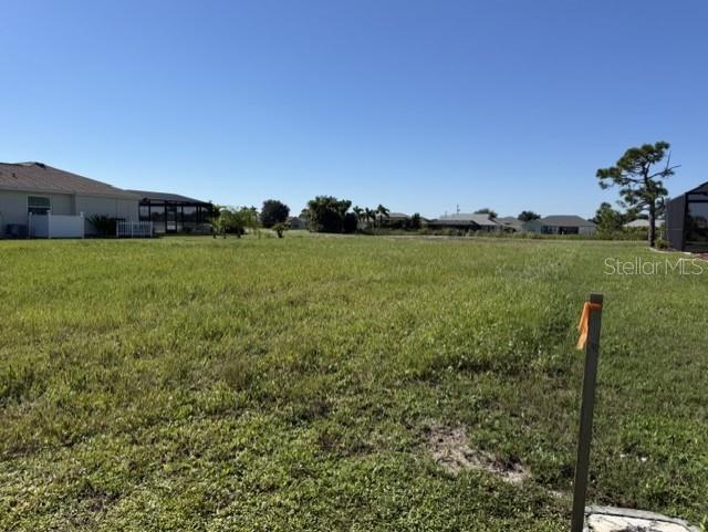 Build your Florida home with a **golf course** view! This freshly **cleared** vacant lot at 25 Pinehurst Court in Rotonda West backs directly to the golf course, providing an attractive open setting and a desirable backdrop for your future home. Public utilities are available, and the lot’s north-facing frontage places the backyard to the south—an ideal orientation to consider for a future pool, lanai, and outdoor living area.
Located in the established deed-restricted community of Rotonda West, residents enjoy access to five golf courses in and bordering the community, along with parks, walking and biking opportunities, playground and recreational areas, and miles of canals, lakes, and ponds.  Beautiful Gulf beaches, boating, fishing, shopping, dining, and the coastal communities of Englewood and Boca Grande are all within easy reach. Whether you are planning a full-time residence, seasonal retreat, or future investment, this golf-course lot offers an opportunity to build in one of Southwest Florida’s established golf communities. Bring your builder and start planning your Florida home!