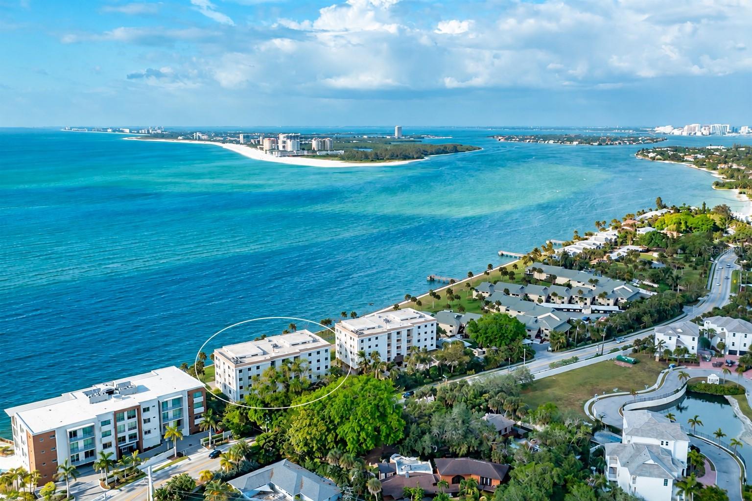 Virtually Staged - Perfectly positioned to capture the ever-changing beauty of the Gulf, this northwest-facing residence offers a front-row seat to nature’s daily masterpiece. From the lush green lawn and swaying palm fronds to the Gulf’s ever-changing shades of turquoise, blue, and emerald, the views unfold in layers of coastal color. As the day draws to a close, the western sky ignites in brilliant sunset hues, transforming the landscape into a breathtaking panorama that never looks quite the same twice. Here, the view isn’t just something you see—it’s an experience to savor.

Welcome to Windward Passage, where the beauty of Siesta Key meets the comfort of an exceptionally spacious coastal retreat. Offering 1,626 square feet of living space, this two-bedroom, two-bath residence blends timeless Gulf views with thoughtful modern updates. Renovated kitchen and bathrooms, luxury vinyl plank flooring throughout, impact-resistant windows on the waterfront facing side, and a newer air-conditioner provide the perfect balance of style, comfort, and peace of mind.

Situated on the third floor, the home enjoys an ideal elevation—high enough to embrace sweeping coastal scenery while maintaining a wonderful connection to the tropical landscape below. An oversized private garage adds a level of convenience and storage rarely found in condominium living.

Beyond the residence, the best of Siesta Key is practically at your doorstep. Just a leisurely 10-minute stroll brings you to the heart of Siesta Key Village, where lively tiki bars, exceptional dining, boutique shops, and live music create an atmosphere that’s distinctly island. And when the beach calls, the nearest public beach access lies just beyond "The Village" or an even easier 5-minute bike ride away.

Whether you’re seeking a full-time residence or a cherished coastal getaway, this is a place to slow down, settle in, and appreciate the extraordinary beauty of everyday life on Siesta Key.

Some properties are defined by their features. Others are remembered for how they make you feel. This one offers both.