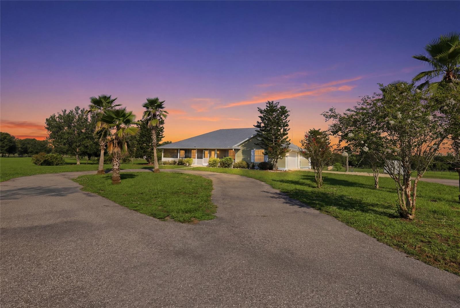 Welcome to peaceful country living situated on over 5.25 acres, this custom-built, one-owner home offers more than 1,800 square feet of living space with 3 bedrooms and 2 bathrooms. The property is fully fenced and gated, providing privacy and plenty of room to enjoy the outdoors. A Generac whole home generator adds to the thoughtful touches. 

Relax on the screened front porch with a porch swing, unwind on the screened back porch overlooking the property, or enjoy the convenience of your own outdoor shower. A large pond creates a beautiful backdrop, while the attached two-car garage provides ample parking and storage.

With plenty of space to spread out and enjoy the Florida countryside, this property offers privacy, freedom, and laid-back lifestyle. Come experience the quiet, the space, and the possibilities of life on over five acres.
