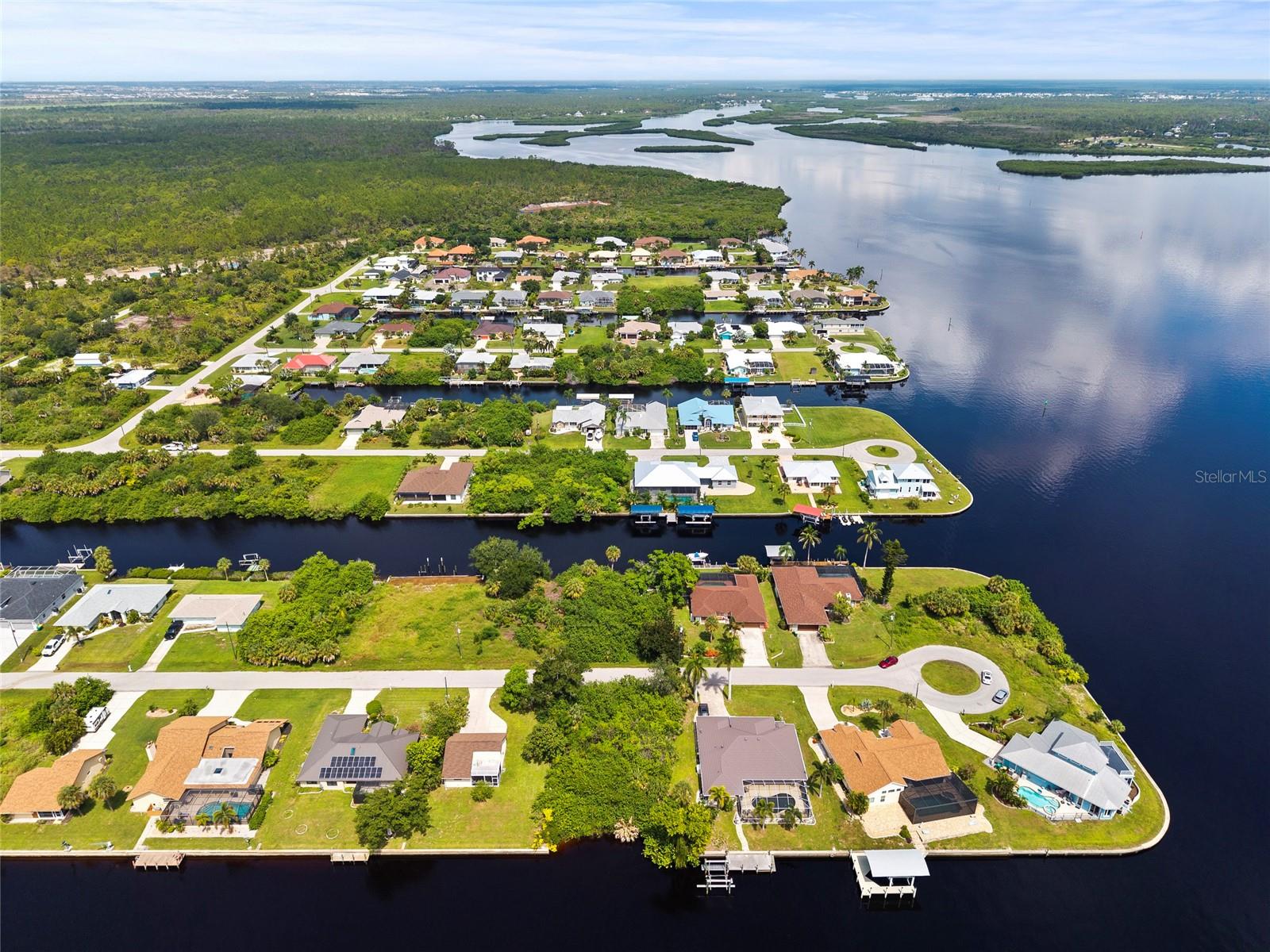 Waterfront Opportunity with Direct Canal Access! Don’t miss this exceptional opportunity to own a waterfront homesite with direct access to the canal. This property offers the perfect setting for those looking to build a custom home and enjoy Florida’s waterfront lifestyle. Bring your boat, kayak, paddleboard, or fishing gear and take advantage of the convenience of having the water right in your backyard. Whether you envision a peaceful retreat or a full-time waterfront residence, this property provides a fantastic opportunity to create your own slice of paradise. Conveniently located near area amenities, shopping, and dining. Waterfront land with direct water access—ready for your vision!