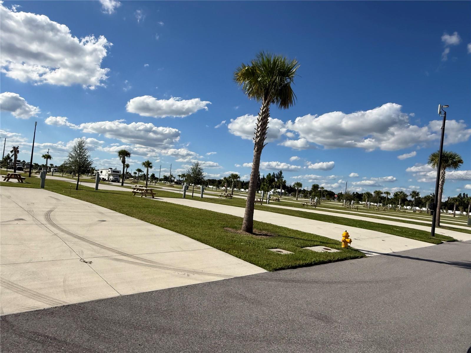 WATERFRONT RV PARADISE! DELUXE LOT 251 – RESORT-STYLE LIVING AT AN AFFORDABLE PRICE! Welcome to Palm Breeze RV Resort in beautiful Punta Gorda, Florida! Discover your own piece of paradise with this spacious 40’ x 70’ deluxe waterfront RV lot offering gorgeous water views and plenty of extra room to create your dream outdoor retreat! Add a patio, tiki hut, outdoor seating, and tropical landscaping to make this space truly your own, subject to resort approval. Enjoy luxury resort living without the luxury price tag! This beautifully maintained community features immaculate grounds and outstanding amenities, including a heated swimming pool, hot tub and spa, fitness center, pickleball courts, putting green, shuffleboard, clubhouse, tiki huts, fire pits, dog park, playground, catch-and-release fishing, laundry facilities, and convenient shower and bathhouse facilities. Golf carts are welcome! Enjoy a full calendar of seasonal activities and social events while meeting new friends and embracing the Florida sunshine! Conveniently located just off I-75, minutes from historic downtown Punta Gorda, Fishermen’s Village, waterfront dining, boutique shopping, and entertainment. Punta Gorda Airport is approximately 2 miles away, with easy access to Fort Myers, Venice, Englewood, and Southwest Florida’s beautiful beaches. Monthly HOA fees are just $370! Rental opportunities are available, subject to community rules and restrictions. Whether you’re searching for a seasonal getaway, winter retreat, or investment opportunity, this waterfront lot offers endless possibilities! PRICED TO SELL QUICKLY! BRING YOUR RV, YOUR GOLF CART, AND YOUR FLIP-FLOPS! YOUR FLORIDA PARADISE AWAITS! Schedule your private showing today!
