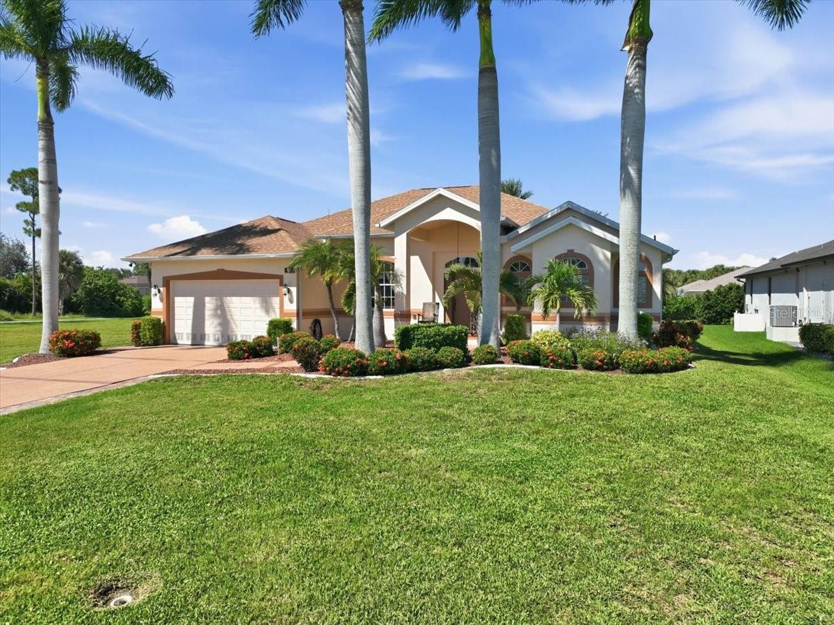 This former builder’s model home showcases upgraded finishes and thoughtful design throughout. Featuring 24x24 porcelain tile in the main living areas and luxury vinyl flooring in the bedrooms, the home sits on an oversized 200x80 lot backing to a peaceful greenbelt. Inside, you’ll find soaring ceilings, including 11-foot ceilings and tray details that enhance the open living space. The kitchen is well-appointed with maple cabinetry, granite countertops, stainless steel LG appliances with smart connectivity, under-cabinet lighting, and ample storage—perfect for everyday living and entertaining. The primary suite offers a relaxing retreat with tray ceilings, direct access to the pool, and a spacious walk-in closet. The ensuite bath features dual vanities, a jetted tub, and a large walk-in shower with multiple showerheads. Step outside to your private lanai with a heated pebble-tech pool, waterfall feature, and panoramic screen enclosure. Paver decking, a covered seating area, outdoor shower, and dedicated grilling space make this an ideal outdoor oasis. Additional highlights include a pool-access guest bath, a functional laundry room with storage and sink, and a two-car garage with epoxy flooring and hurricane-rated door. This home blends comfort, style, and Florida outdoor living—schedule your private showing today. Features: Former builder’s model with upgraded finishes Oversized 200x80 lot on greenbelt 24x24 porcelain tile + luxury vinyl flooring in bedrooms 11-ft ceilings with tray ceiling details. Maple cabinets, granite countertops, under-cabinet lighting LG stainless steel smart appliances Primary suite with pool access & walk-in closet Spa-style bath with jetted tub & multi-head shower Heated pebble-tech pool with waterfall Panoramic screen enclosure & paver pool deck Outdoor shower & covered lanai area Pool-access guest bathroom Laundry room with sink, storage & ironing board Epoxy garage floor & hurricane-rated garage door 200-amp electrical panel & irrigation system Pre-wired soffit outlets for holiday lighting 8-ft interior doors throughout