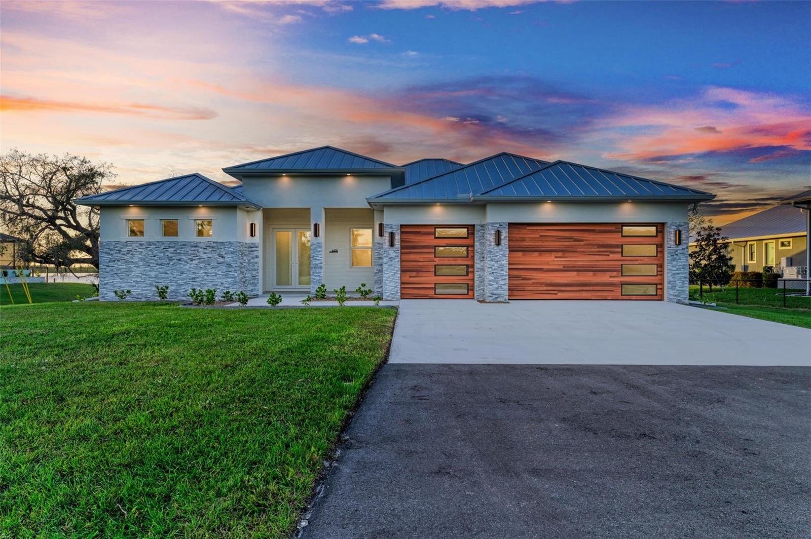 SELLER FINANCING AVAILABLE!  BEAUTIFUL NEW CONSTRUCTION HOME ON THE PEACE RIVER with 3 bedrooms, 3 bathrooms + den, a 3-car garage, and incredible sweeping
views of the water with 104 feet of concrete seawall awaits new owners! Enjoy an estate like entry on this 1.19 acre property with the large oak
trees and long paved driveway. The custom wood look garage doors, stone detail, and covered front porch with double door entry welcome you.
Inside, enter a spacious foyer open to the massive great room with a wall of glass doors capturing incredible views of the pool/spa/lanai and the
private unobstructed water views. The great room is also open to the gourmet kitchen with high-end appliances, quartz counters, a custom
hood, large island with breakfast bar and a separate bar area with additional cabinetry and beverage center. Behind the kitchen, a spacious
pantry is tucked away in addition to a large walk-in laundry room with fabulous cabinetry, sink, and technology panel. Nearby is also the
connection to the 3 car garage. On the right side of the home, find a back guest bedroom with en suite bathroom, a second guest bedroom and
den, with a conveniently located guest bathroom near the door to the pool. On the opposite side, the primary suite is a dream with beautiful
views and private access to the lanai, a massive spa-like bathroom with freestanding tub, large shower with glass enclosure, dual vanities with
incredible back-lit mirrors and custom lighting, and farther in, find a large walk-in closet. On the back of the home, the lanai has a large, heated
pool/spa with pebble-tec finish, and is ready for a summer kitchen. With no deed restrictions, great water access and privacy, and room for an
addition or detached garage/ADU, this home and property are uniquely suited to discerning buyers, nearby to all things Punta Gorda, including
great restaurants, shopping, the PGD airport, I-75, and more! BE SURE TO CLICK THE FULL VIRTUAL TOUR LINKS FOR DETAILS!