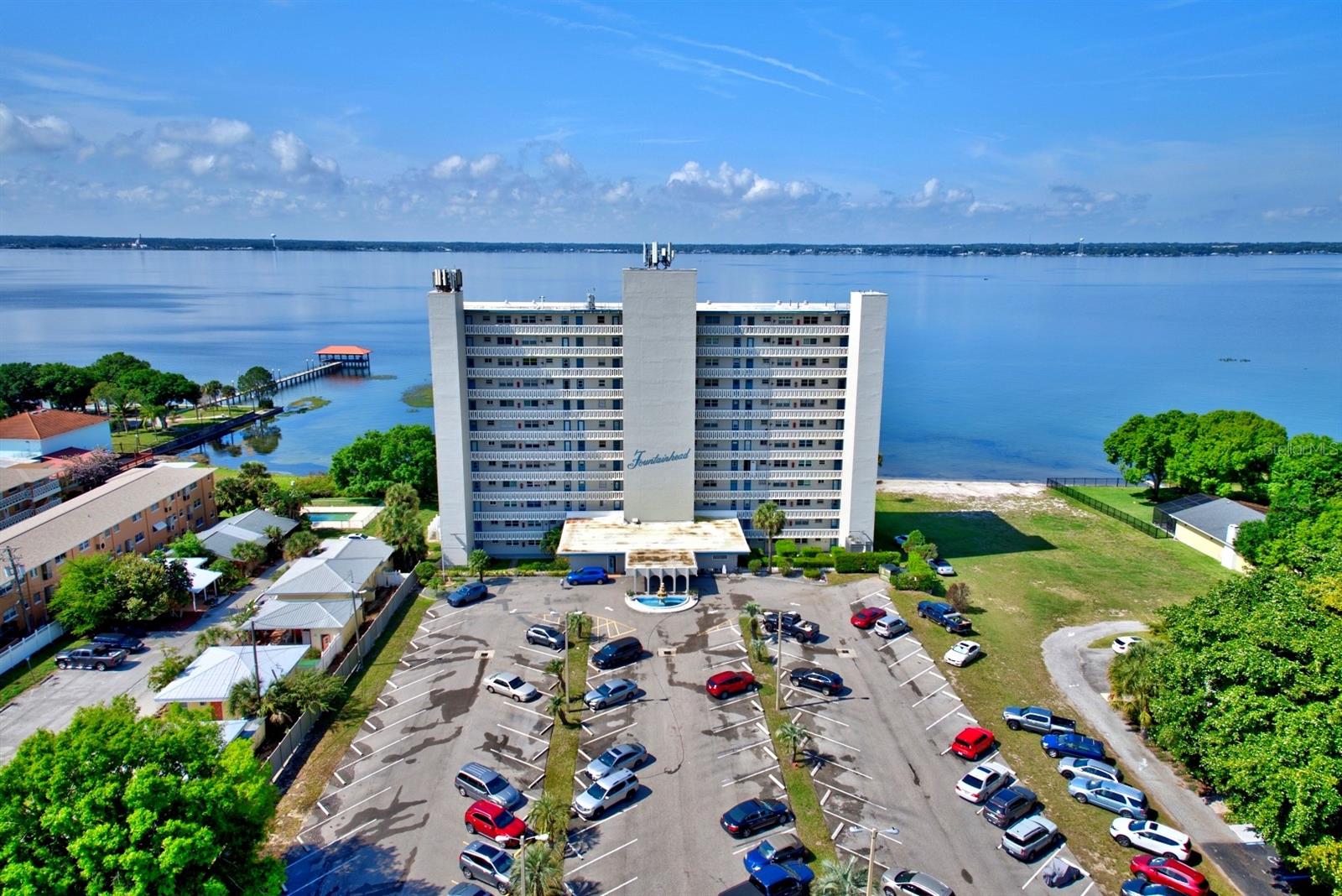 BREATHTAKING PANORAMIC VIEWS OF LAKE JACKSON, SPECTACULAR SUNSETS, AND EFFORTLESS WATERFRONT LIVING! Experience the beauty of lakefront living from this exceptional 5th-floor end unit residence at the desirable Fountainhead Condominiums, where sweeping views of picturesque Lake Jackson create an extraordinary backdrop for everyday living. Perfectly positioned to capture some of the most spectacular waterfront scenery in Sebring, this beautifully updated 2-bedroom, 2-bath condominium offers an inviting combination of comfort, style, convenience, and the carefree Florida lifestyle! Step inside and discover a thoughtfully designed residence featuring a beautifully renovated kitchen that offers modern elegance with everyday functionality. Gorgeous granite countertops, crisp white cabinetry, and sleek stainless steel appliances create a bright, sophisticated space ideal for preparing meals and entertaining guests! The spacious primary bedroom offers a truly remarkable retreat, showcasing captivating views of Lake Jackson and front-row seats to breathtaking sunsets that transform the evening sky into a spectacular display of color. Imagine unwinding at the end of each day while enjoying the peaceful beauty of the shimmering lake and its ever-changing scenery - with picturesque waterfront views as your daily backdrop, every day feels like a vacation! Offered partially furnished, this inviting residence provides an excellent opportunity to embrace the Florida lifestyle without the hassle of starting from scratch. New electrical 200 amp breaker installed 2 years ago. Residents of Fountainhead enjoy an impressive selection of amenities designed for recreation, relaxation, and convenience, including a heated swimming pool, fitness room, library, laundry facilities, and access to a dock - perfect for those who appreciate spending time on the water. Whether enjoying a refreshing swim, staying active, or exploring the natural beauty of Lake Jackson – The Fountainhead offers something for everyone! Ideally situated within walking distance of Sebring's charming historic Downtown Circle, you'll enjoy convenient access to local boutiques, popular restaurants, shopping, entertainment, and community events. Experience the perfect balance of peaceful waterfront surroundings and the vibrant atmosphere of downtown Sebring, all just moments from your doorstep! Whether you're searching for a full-time residence, seasonal Florida retreat, or an inviting waterfront getaway - this exceptional condominium presents an outstanding opportunity to enjoy spectacular lake views, unforgettable sunsets, and the freedom of low-maintenance living. Discover your own slice of waterfront paradise at Fountainhead, where every sunset is a reminder of why living on Lake Jackson is so special! Please note: Fountainhead maintains a no-pets policy. Condo HOA Fee: $495/month.