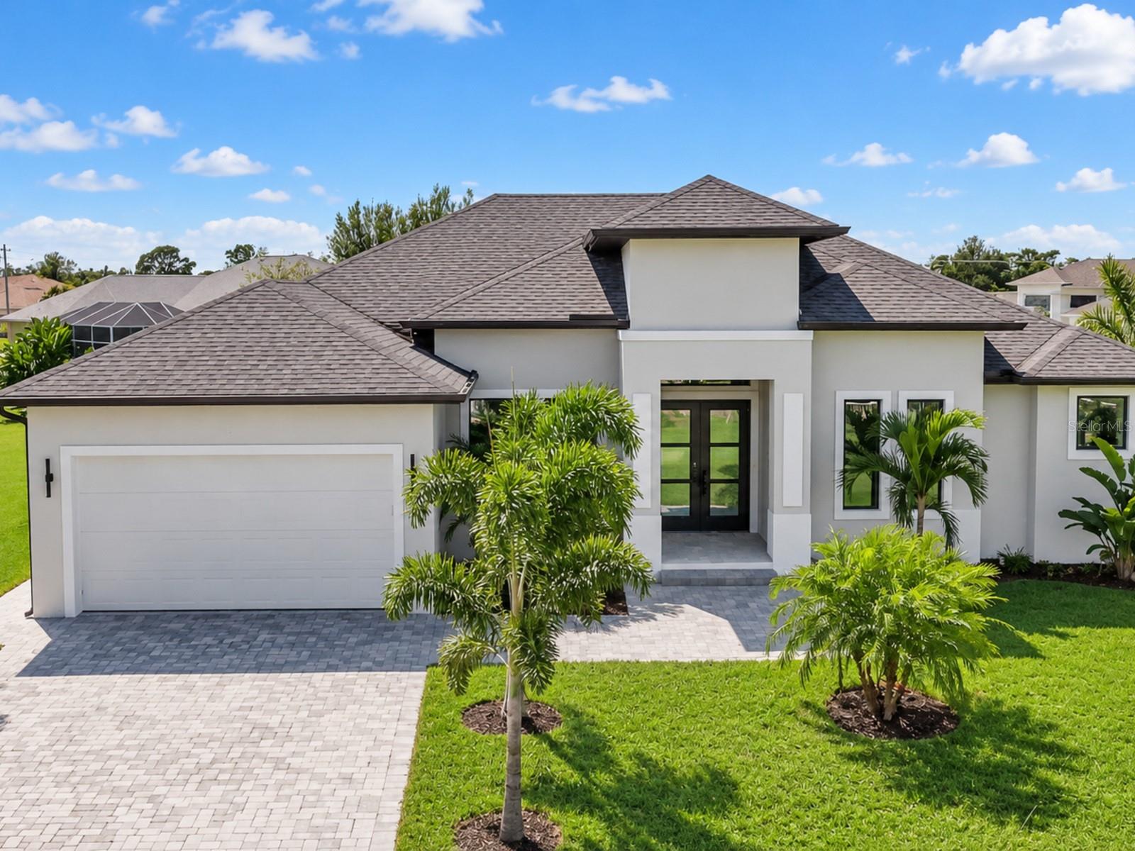 Welcome to this beautiful new-construction home on a spacious half-acre corner lot. This bright and open home offers three bedrooms, an office, two full bathrooms, and one half bathroom.

The large kitchen features plenty of cabinet space, a beautiful waterfall island, a dining area, and a breakfast nook. The living room has 11-foot ceilings, an electric fireplace, and large sliding glass doors that fill the home with natural light. Tile flooring runs throughout.

The spacious primary suite includes two walk-in closets and a beautiful bathroom with a large glass-enclosed shower. The split floor plan places the other two bedrooms on the opposite side of the home for added privacy.

Outside, enjoy the fully screened lanai and private pool, surrounded by mature trees. Tropical landscaping with many palm trees and a paved driveway complete this beautiful property.

Schedule your private showing today!